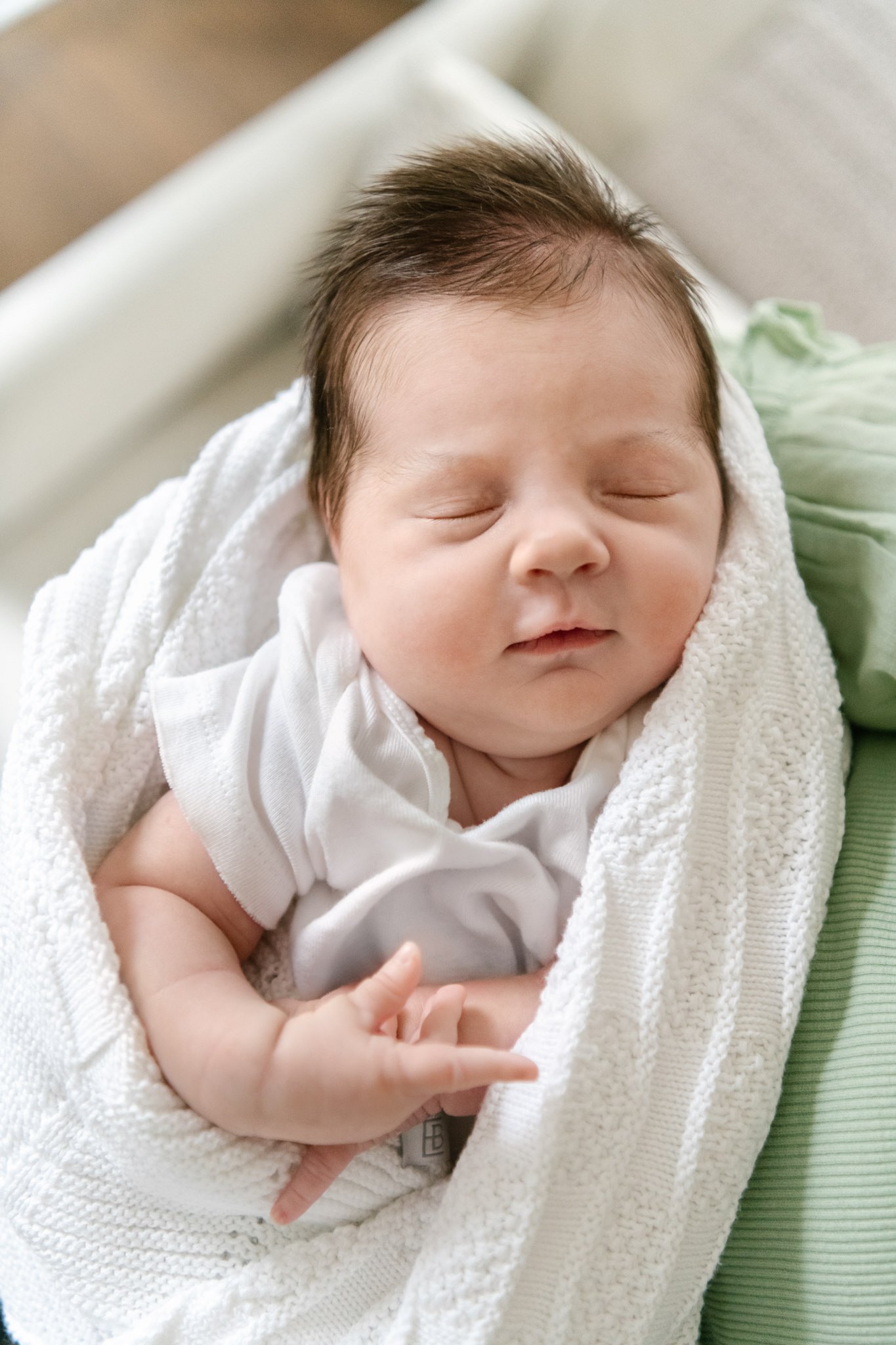  In-home newborn portrait of a little girl with thick dark hair by Nicole Hawkins Photography. sleeping baby in home NJ #NicoleHawkinsPhotography #NicoleHawkinsNewborns #MontclairNewbornPhotographer #InHomeNewborns #NJNewborns #Babygirl #Newbornfamil