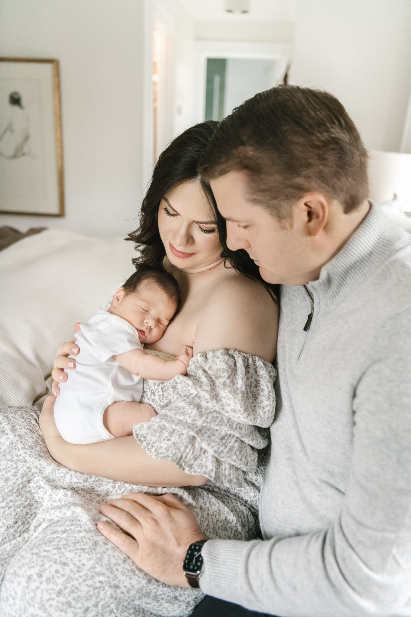  A mother and father look sweetly down at their newborn baby girl captured by Nicole Hawkins PHotography in the Montclair area. in-home newborns NJ/NY newborns #NicoleHawkinsPhotography #NicoleHawkinsNewborns #MontclairNewbornPhotographer #InHomeNewb