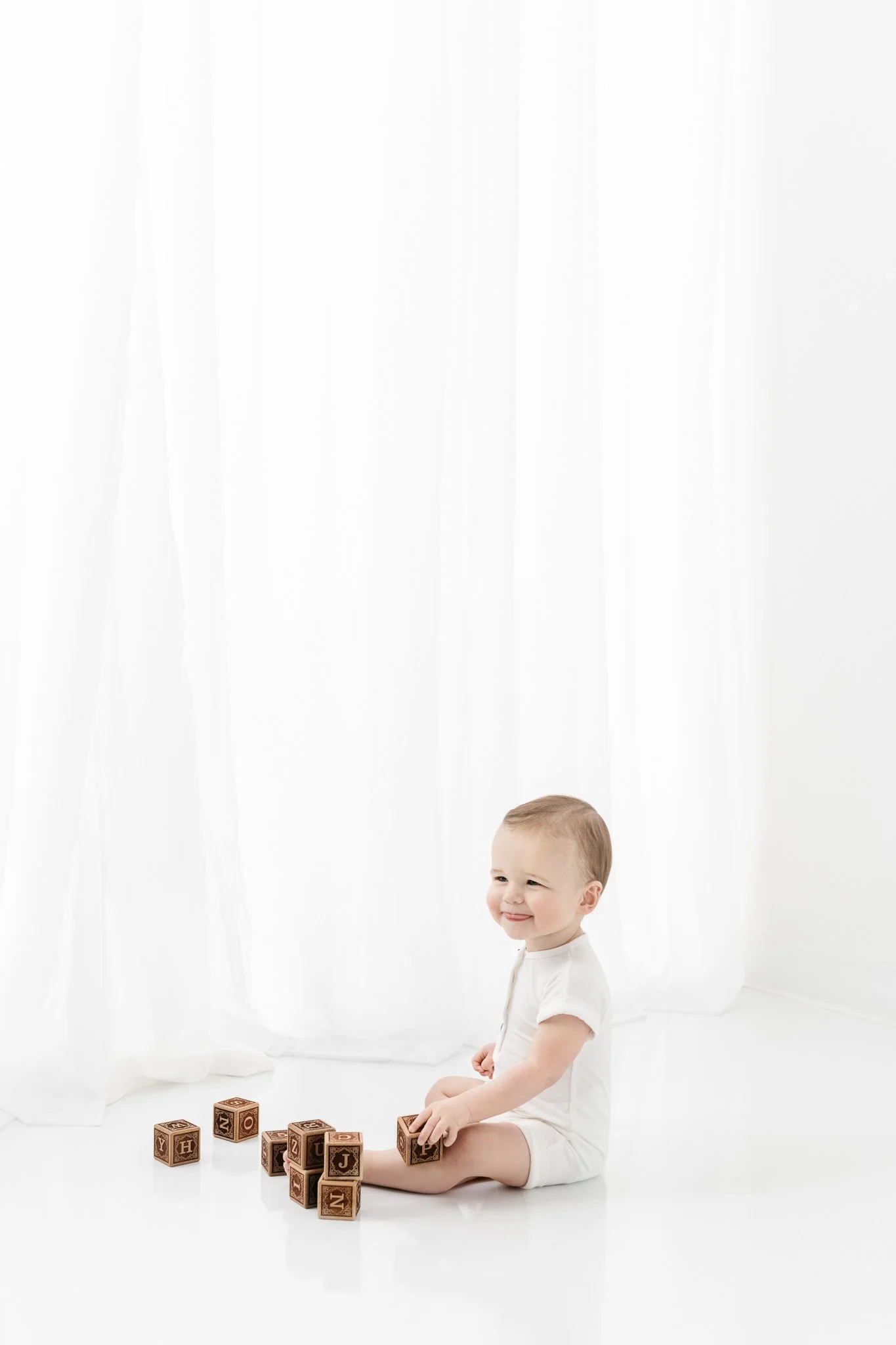  All white New Jersey studio children portraits taken by Nicole Hawkins Photography. baby boy first birthday style ideas #NicoleHawkinsPhotography #NicoleHawkinsBabies #FirstBirthdayPhotography #StudioFamilyPortraits #NJBabies #FirstBirthday #StudioB