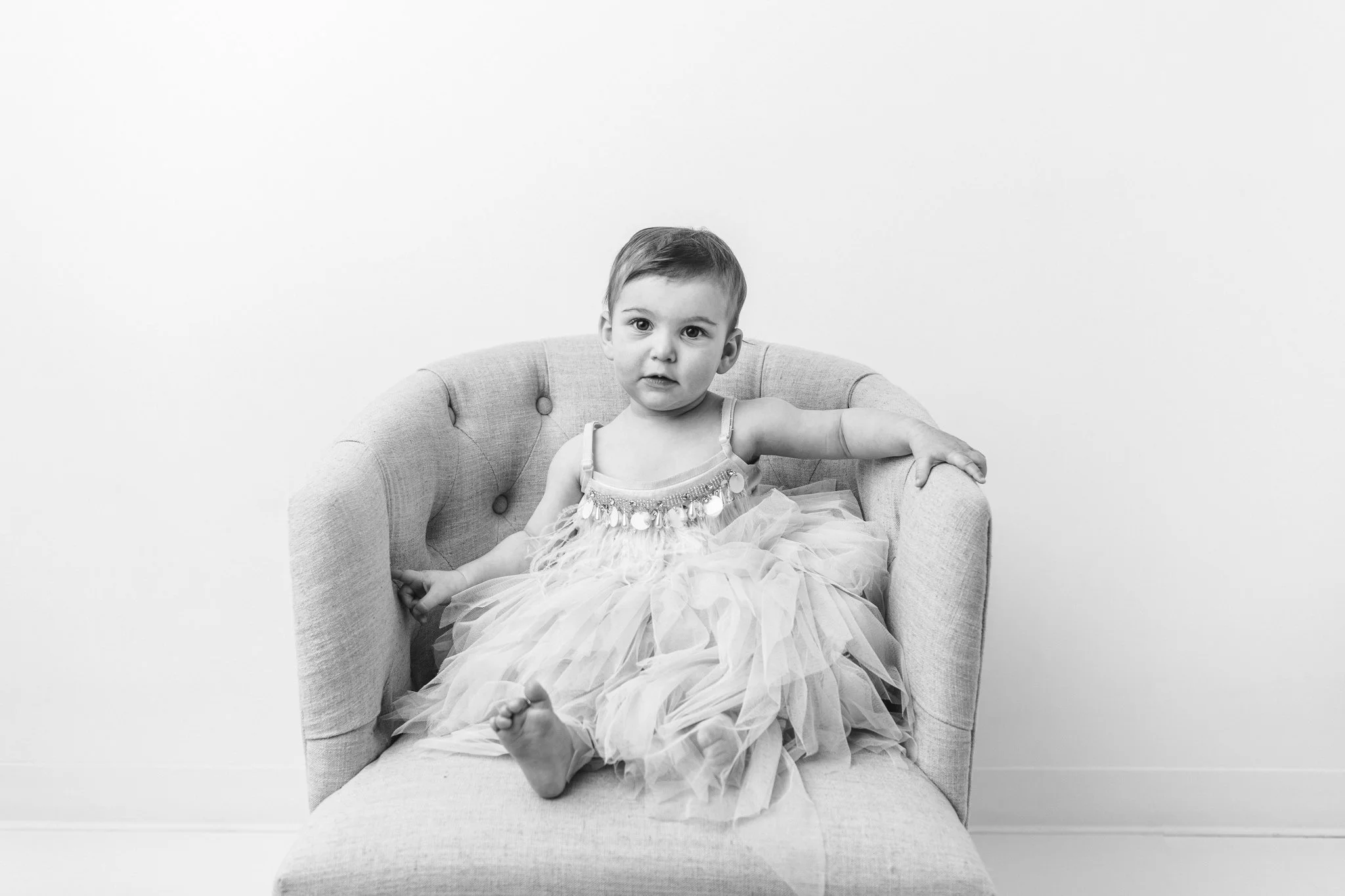  Little girl black and white portrait in a trendy dress captured by Nicole Hawkins PHotogrpahy in the New Jersey area. baby girl in a trendy gown little girl 20's style dress #NicoleHawkinsPhotography #NicoleHawkinsBabies&amp;Children #FirstBirthdayP