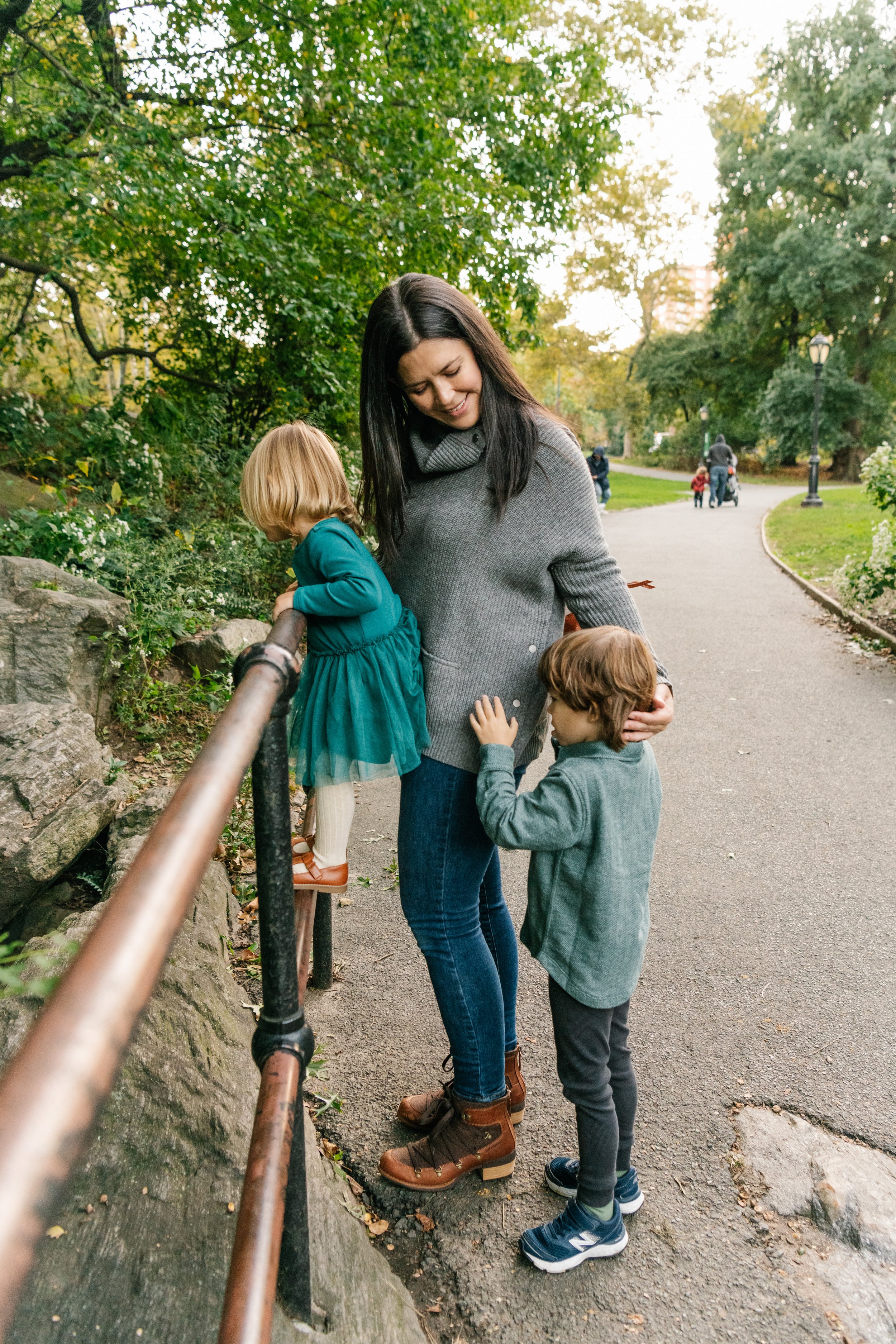  A candid portrait of two kids playing with their mother at Central Park was taken by Nicole Hawkins Photography. candid family portrait shots mother and children playing #NicoleHawkinsPhotography #NicoleHawkinsFamilies #NJphotographers #familyphotos