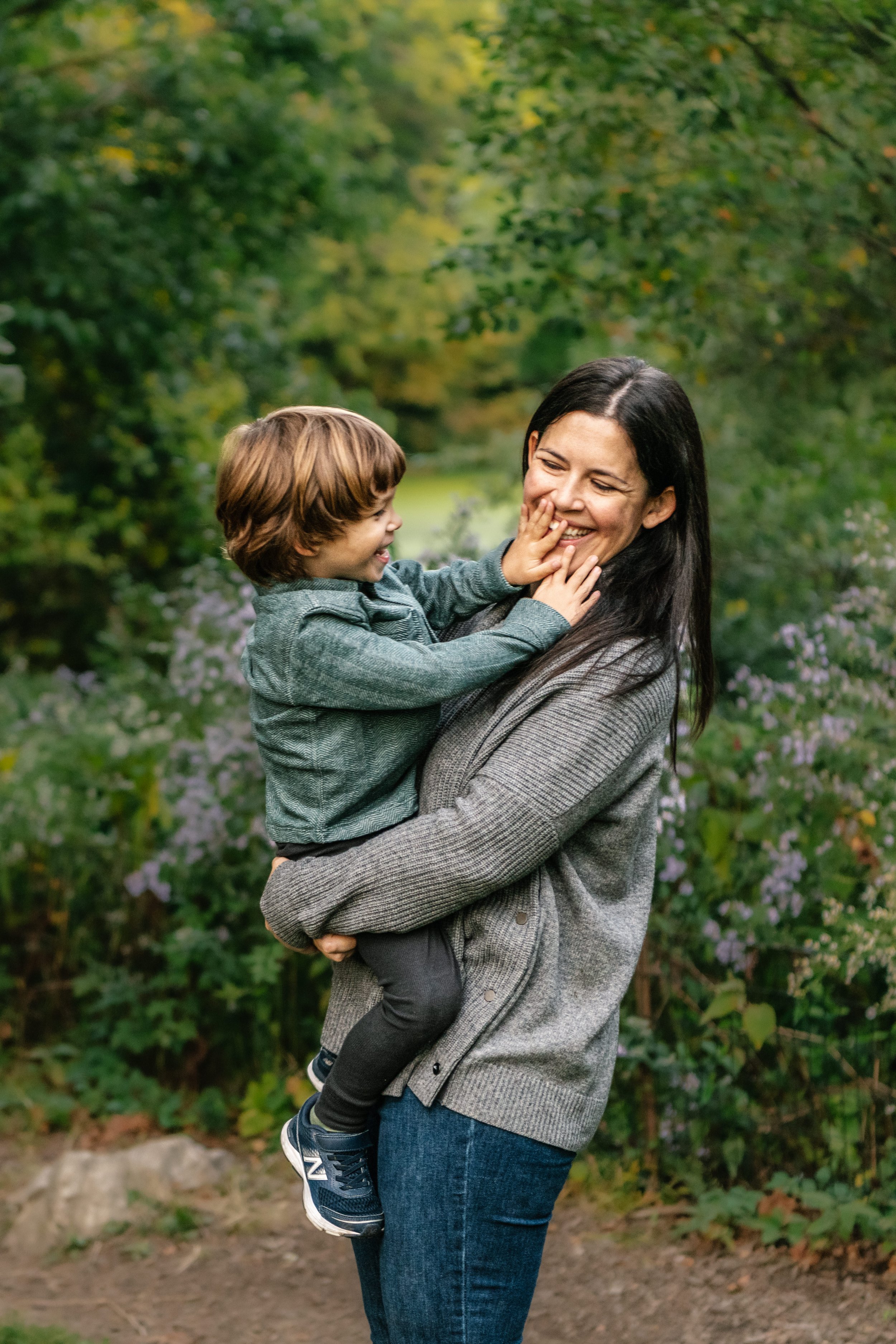  A little boy plays with his mother during a family session in New York with Nicole Hawkins Photography. new York Family PHotographer boy and mom #NicoleHawkinsPhotography #NicoleHawkinsFamilies #NJphotographers #familyphotos #CentralParkPhotography 