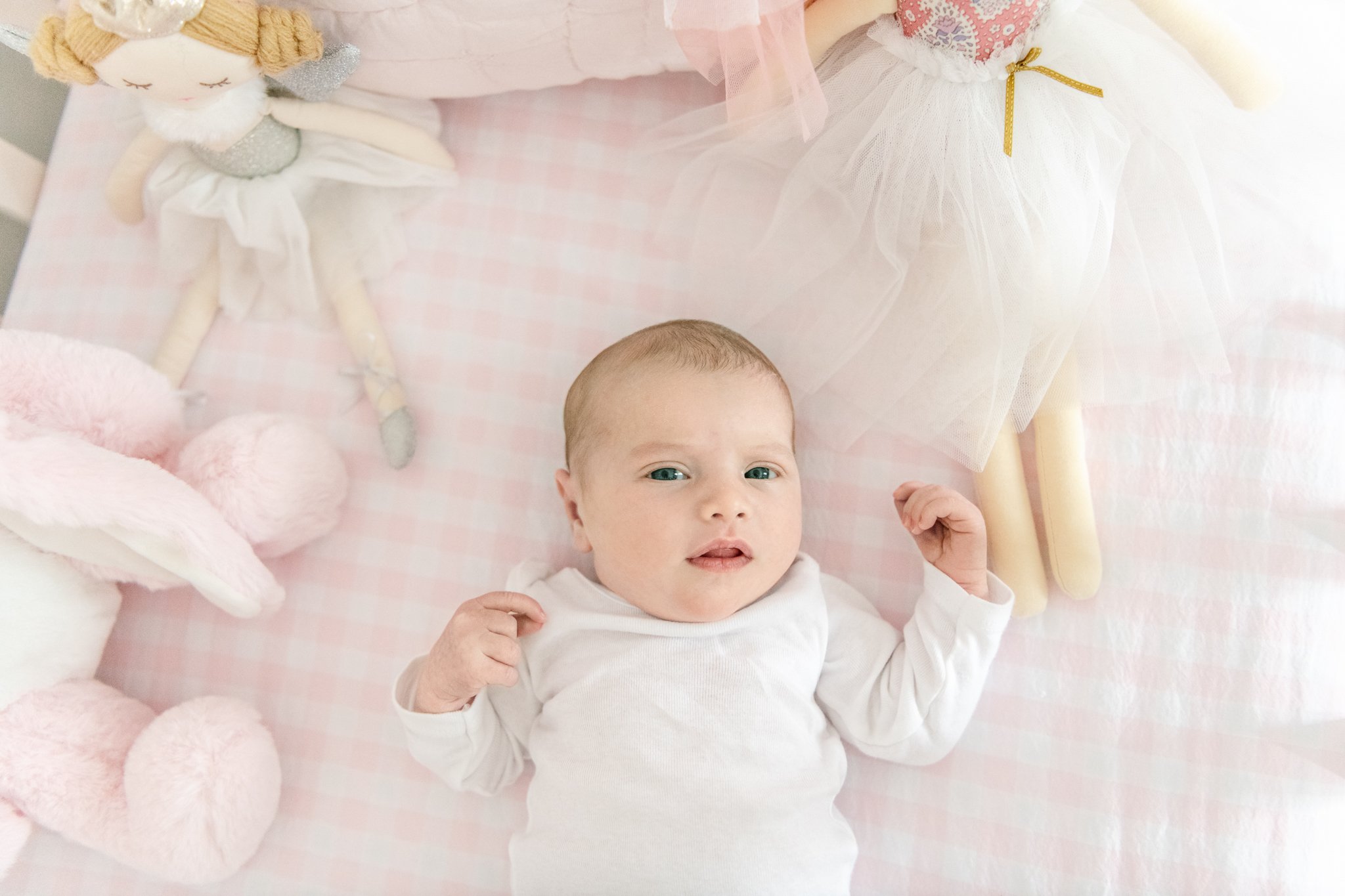  Simple, clean, crisp, and timeless newborn portraits for a classic newborn portrait in the Ma area by Nicole Hawkins Photography. white onesie pink bunny eyes open #NicoleHawkinsPhotography #NicoleHawkinsNewborns #Babygirl #Newbornfamilyportraits #C