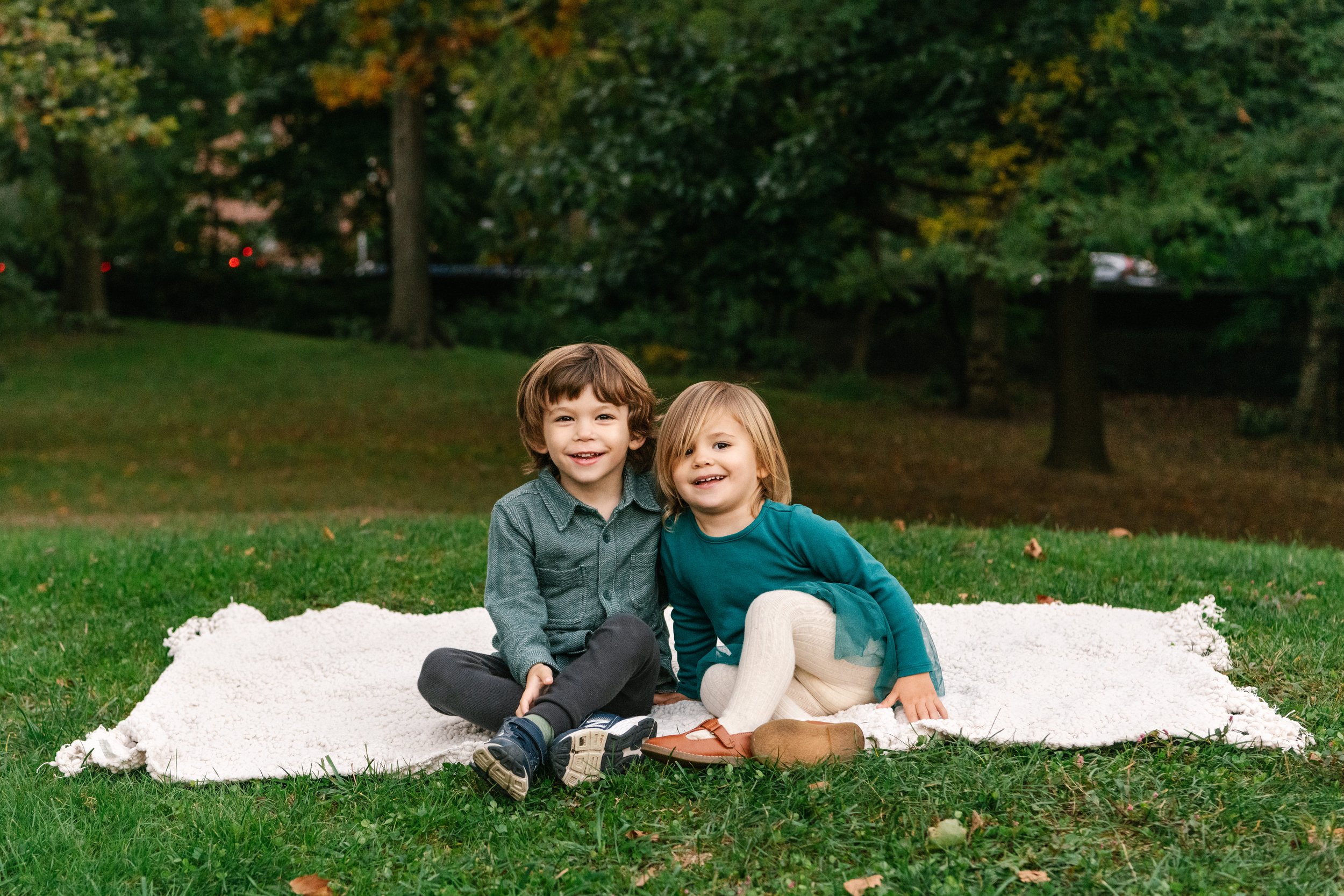  A brother and sister portrait taken in Central Park by Nicole Hawkins Photography in New York City. sibling fall family portraits outdoor leaf portrait #NicoleHawkinsPhotography #NicoleHawkinsFamilies #NJphotographers #familyphotos #CentralParkPhoto