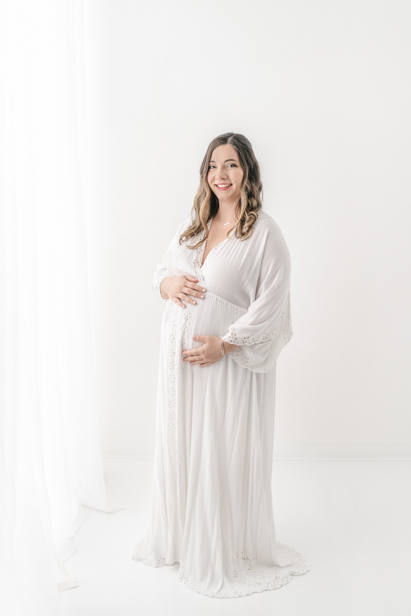  Nicole Hawkins Photography captures a portrait of a soon-to-be-momma in a white studio in Northern New Jersey. mother in a white gauze gown all white studio portraits #NicoleHawkinsPhotography #NicoleHawkinsMaternity #Babyontheway #studiomaternityNJ