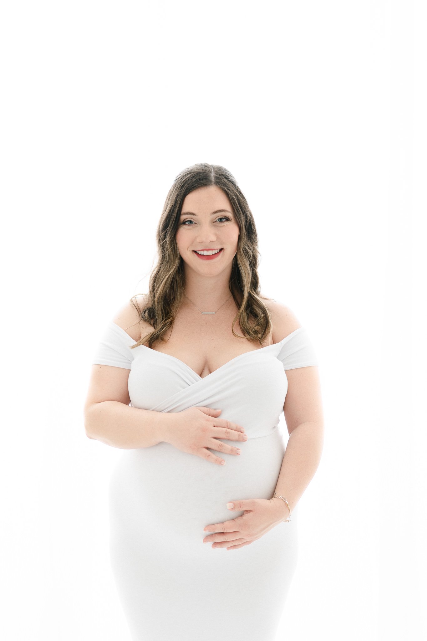  Stretchy white maternity dress on a beautiful glowing mother captured by Nicole Hawkins Photography. stretchy maternity dress glowing mother #NicoleHawkinsPhotography #NicoleHawkinsMaternity #Babyontheway #studiomaternityNJ #whitestudiomaternityport