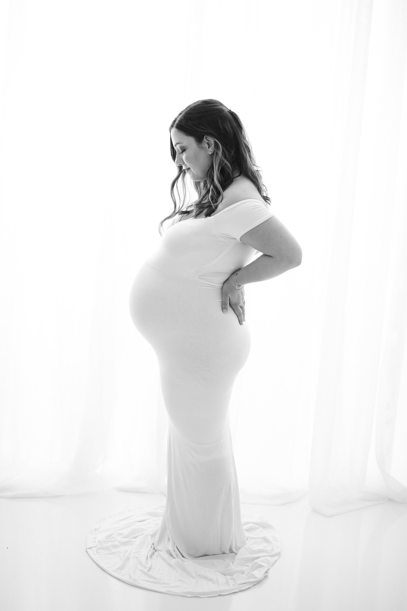  Profile of a Pregnant Mother with bright light behind her by Nicole Hawkins Photography. profile maternity photograph professional maternity portraits #NicoleHawkinsPhotography #NicoleHawkinsMaternity #Babyontheway #studiomaternityNJ #whitestudiomat