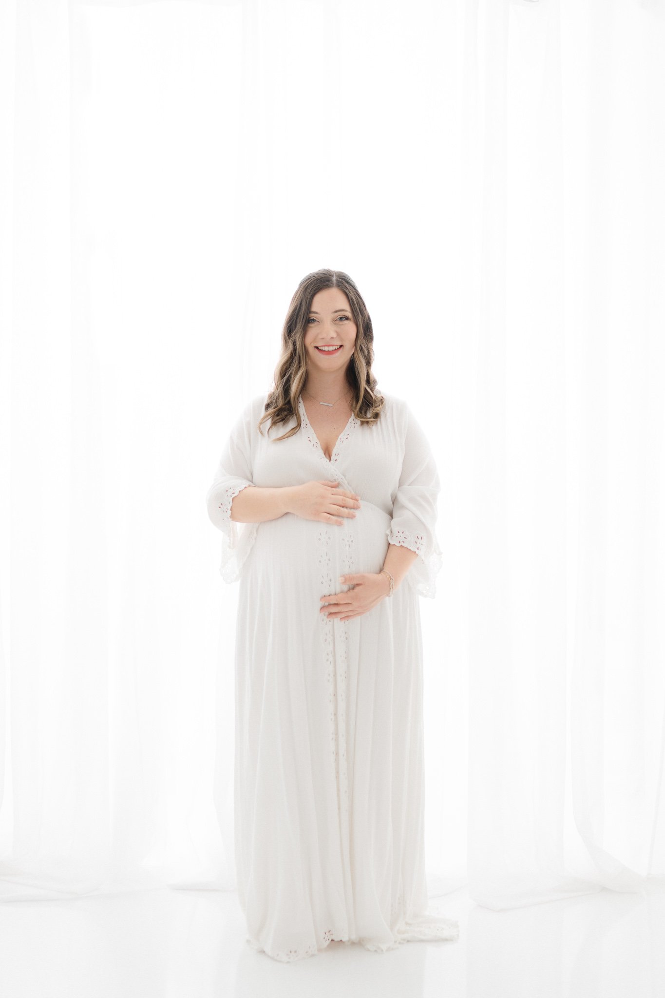  Studio maternity photography was taken in Northern New Jersey by Nicole Hawkins Photography. white studio maternity portraits white maternity dress #NicoleHawkinsPhotography #NicoleHawkinsMaternity #Babyontheway #studiomaternityNJ #whitestudiomatern