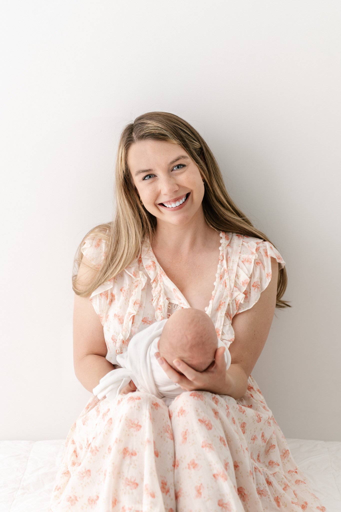  Nicole Hawkins Photography captures a portrait of a new mother and her glowing smile. mother dress women outfits for newborn portraits east coast mothers #NicoleHawkinsPhotography #NicoleHawkinsNewborns #StudioNewborn #StudioFamily #EastCoastNewborn