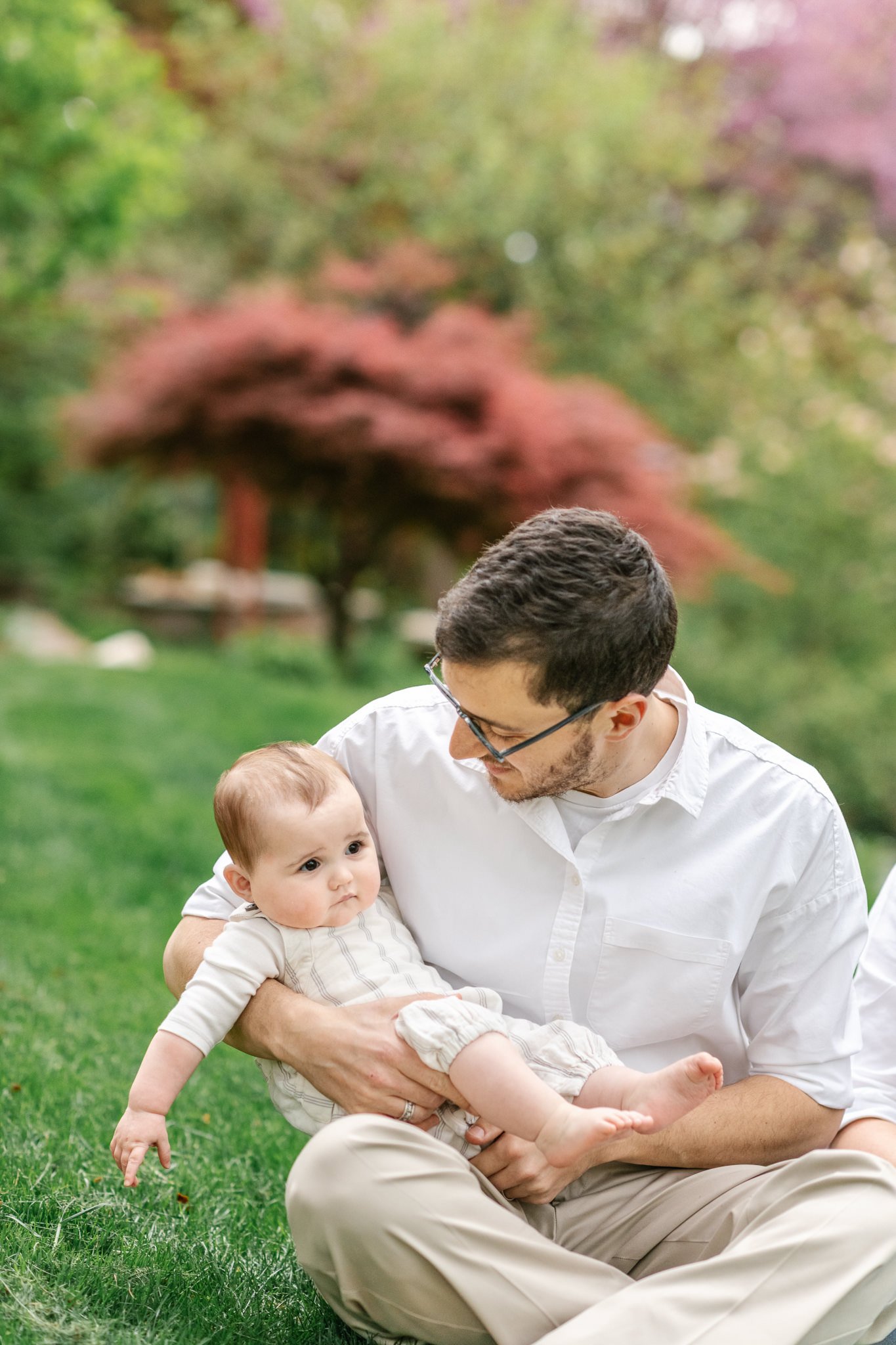  Sitting in his yard in South Orange, NJ a father smiles at his little girl by Nicole Hawkins Photography. yard portraits daddy photo #NicoleHawkinsPhotography #NicoleHawkinsfamilies #AtHomePortraits #EastCoastFamilyPhotographer #NewJerseyInHomePhoto