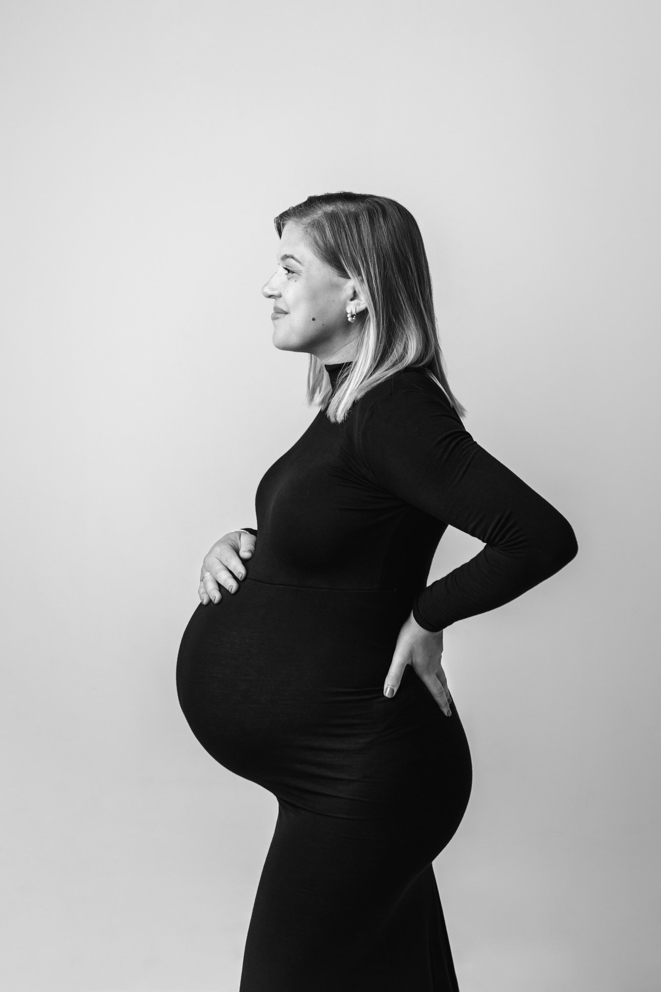  New Jersey maternity photographer Nicole Hawkins Photography captures a timeless maternity portrait of a mother in her third trimester. black fitted maternity dress stunning maternity portrait #NicoleHawkinsPhotography #NicoleHawkinsMaternity #Mater