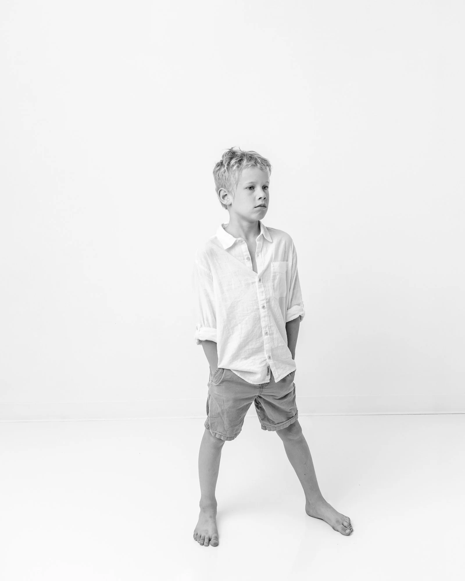   Black and white photo of preteen boy during family photo session in Northern New Jersey with Nicole Hawkins Photography. Family photo pose ideas for preteens #EssexCountyFamilyPhotographer #MorrisCountyFamilyPhotographer #ManhattanFamilyPhotographe