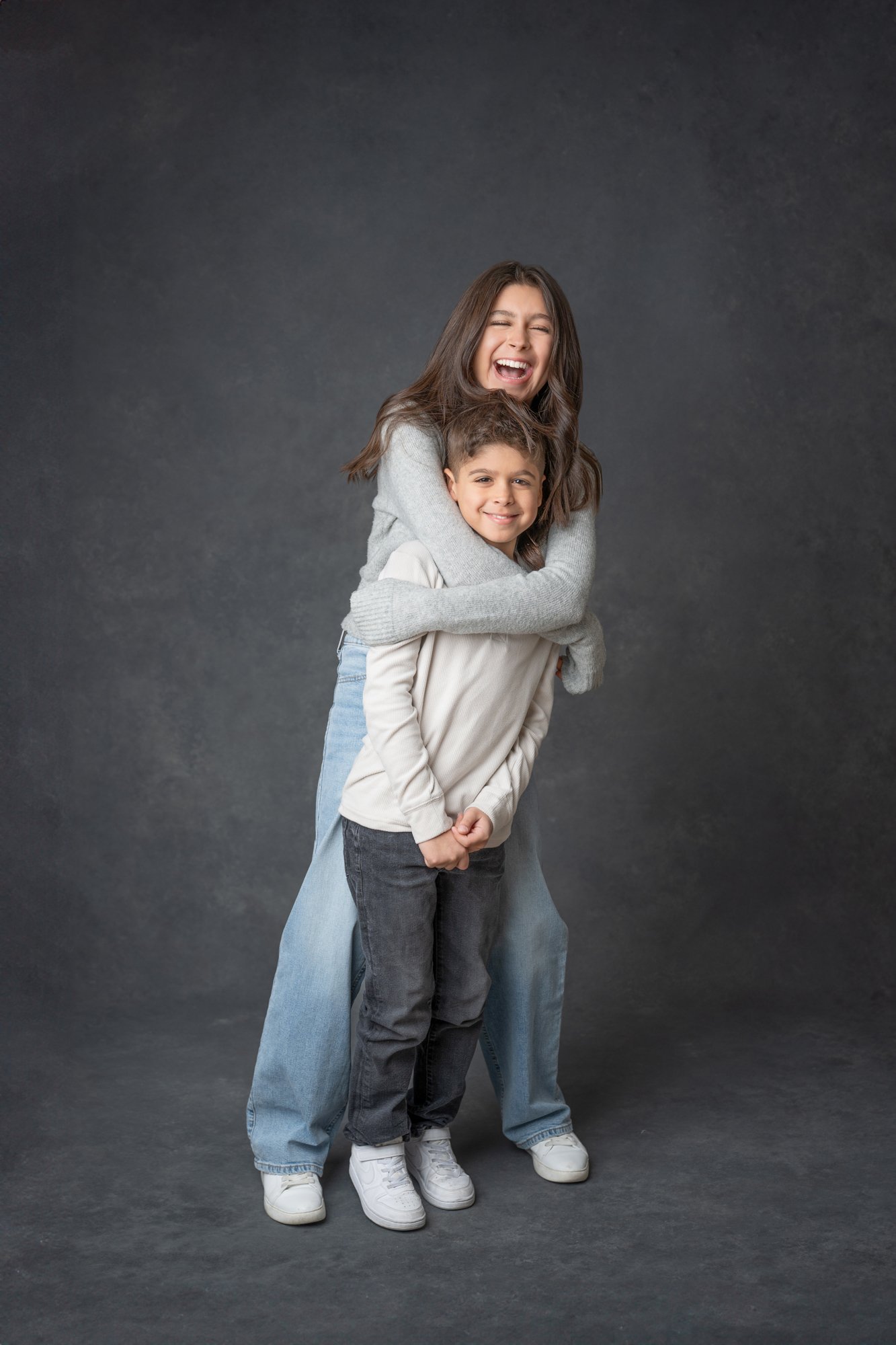   Mom hugging preteen son during a studio portrait session with Nicole Hawkins, Northern New Jersey Family Photographer. Mother son photo pose ideas family photo pose suggestions #UnionCountyFamilyPhotographer #PassaicCountyFamilyPhotographer #Northe