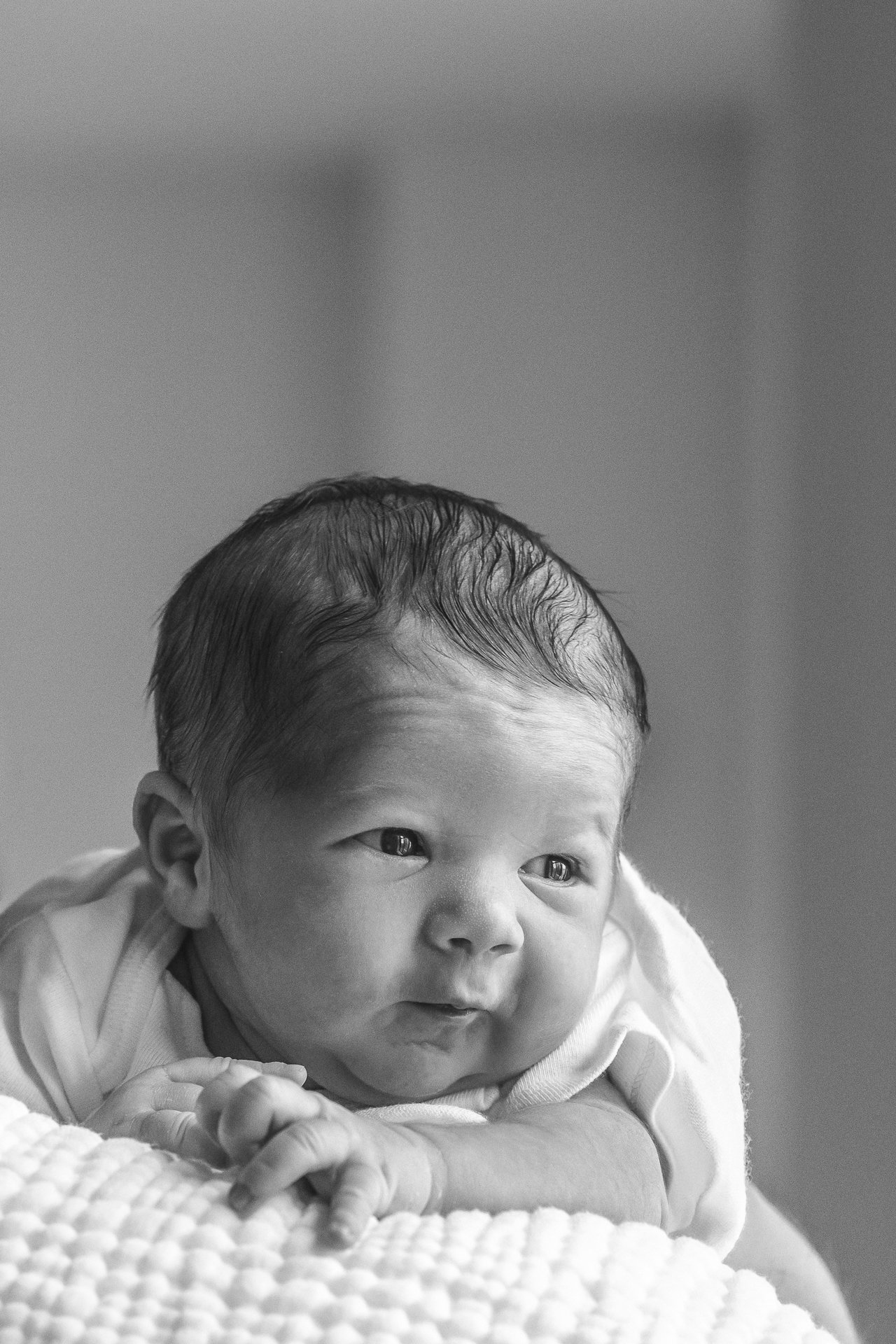   Closeup black and white newborn portrait taken by Nicole Hawkins, New Jersey newborn photographer. Newborn photo posing ideas #EssexCountyFamilyPhotographer #BergenCountyFamilyPhotographer #NorthernNewJerseyFamilyPhotographer #ManhattanPhotographer