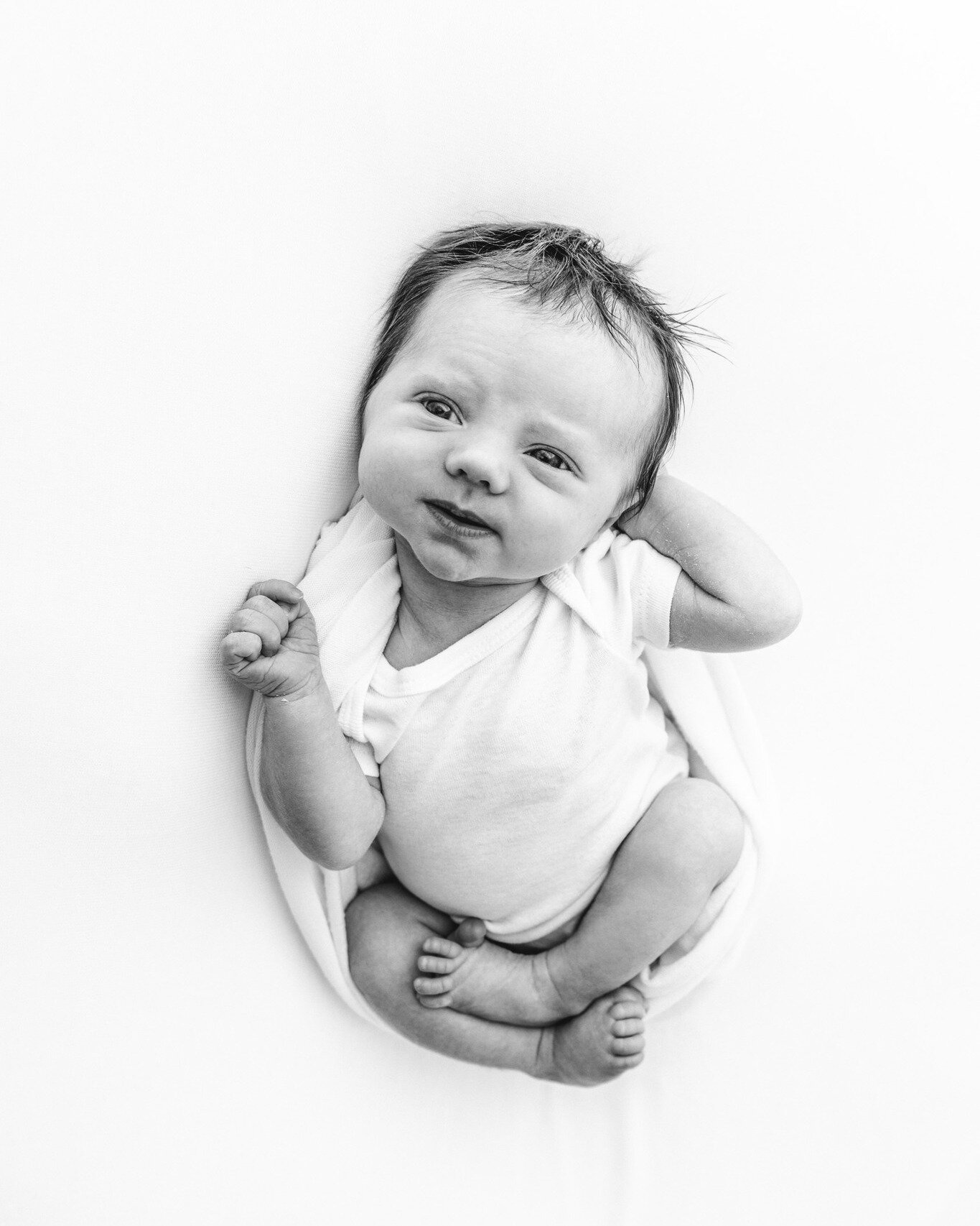 Newborn sessions always involve the cutest little faces. I love the range of emotions we got during this sweet girl&rsquo;s studio newborn session.