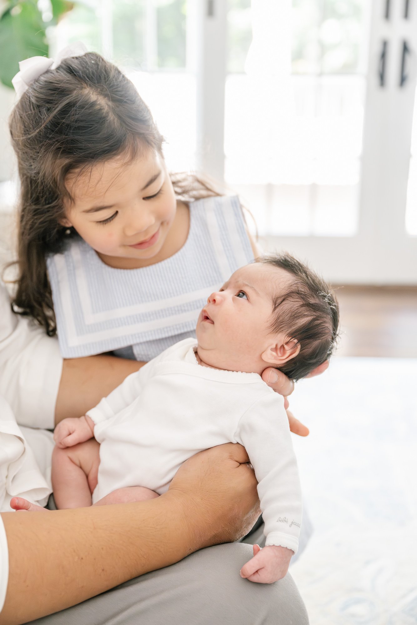  Nicole Hawkins, a New Jersey-based photographer, shares tips on when to book your family's milestone photography sessions, to document your ever-changing family. Essex New Jersey newborn traditional milestone document siblings #njchildrenphotographe