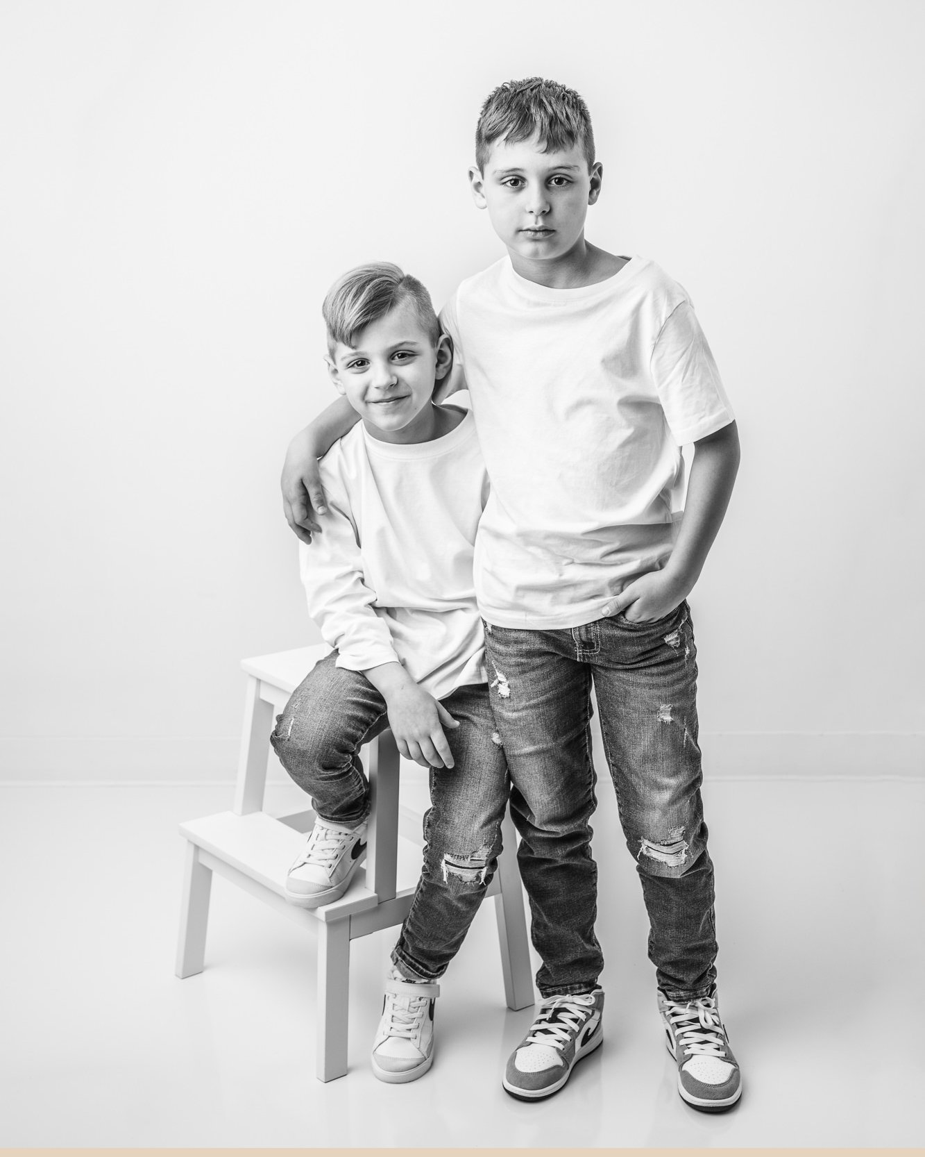 My studio is clean and minimalistic, allowing personalities, feelings, and relationships to shine. With a fresh and simple backdrop, your family stays the focus of the session. Classic.