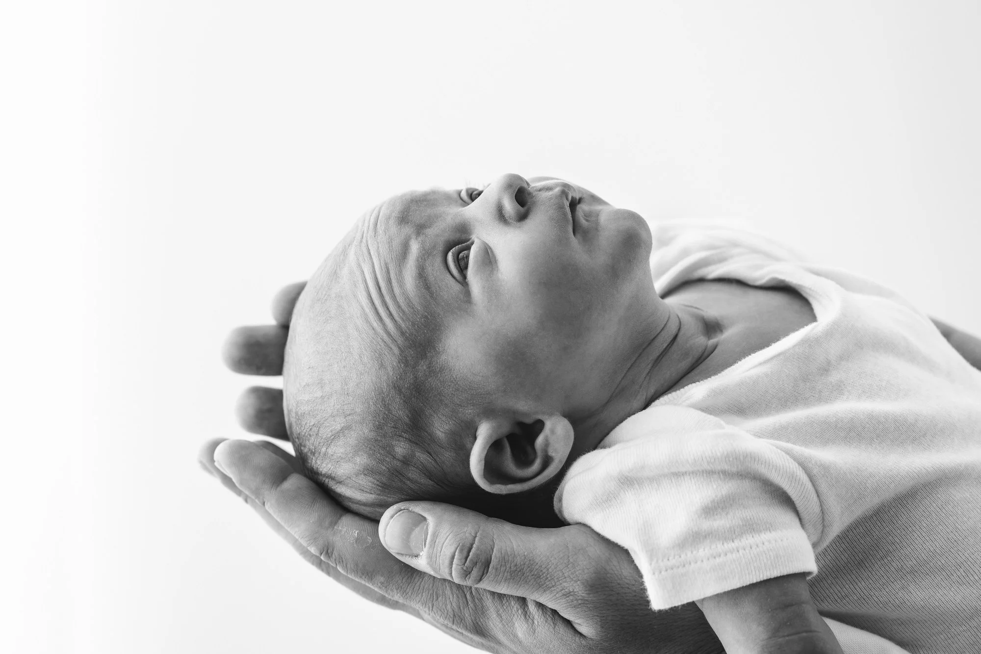 Little sweet newborn dressed in neutral colors for in studio portrait session with Nicole Hawkins photography. #instudionewbornsession #NicoleHawkinsphotography #newbornportraits #NewJerseynewbornphotographer #NewJerseyportraits