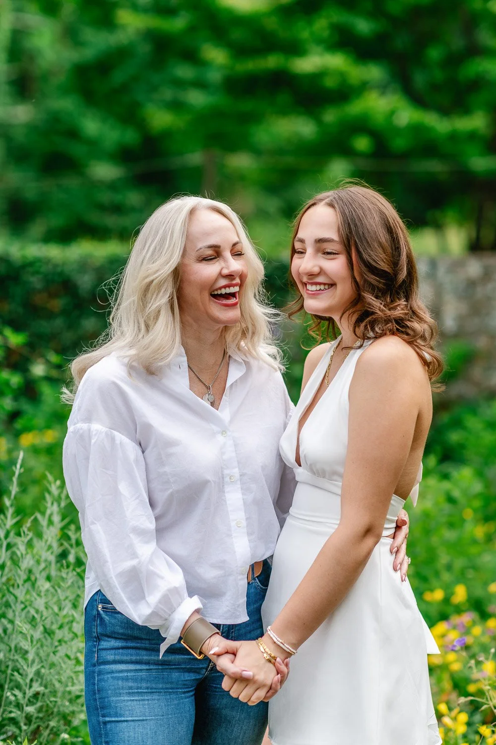 Mother and daughter laughing together during senior portraits
