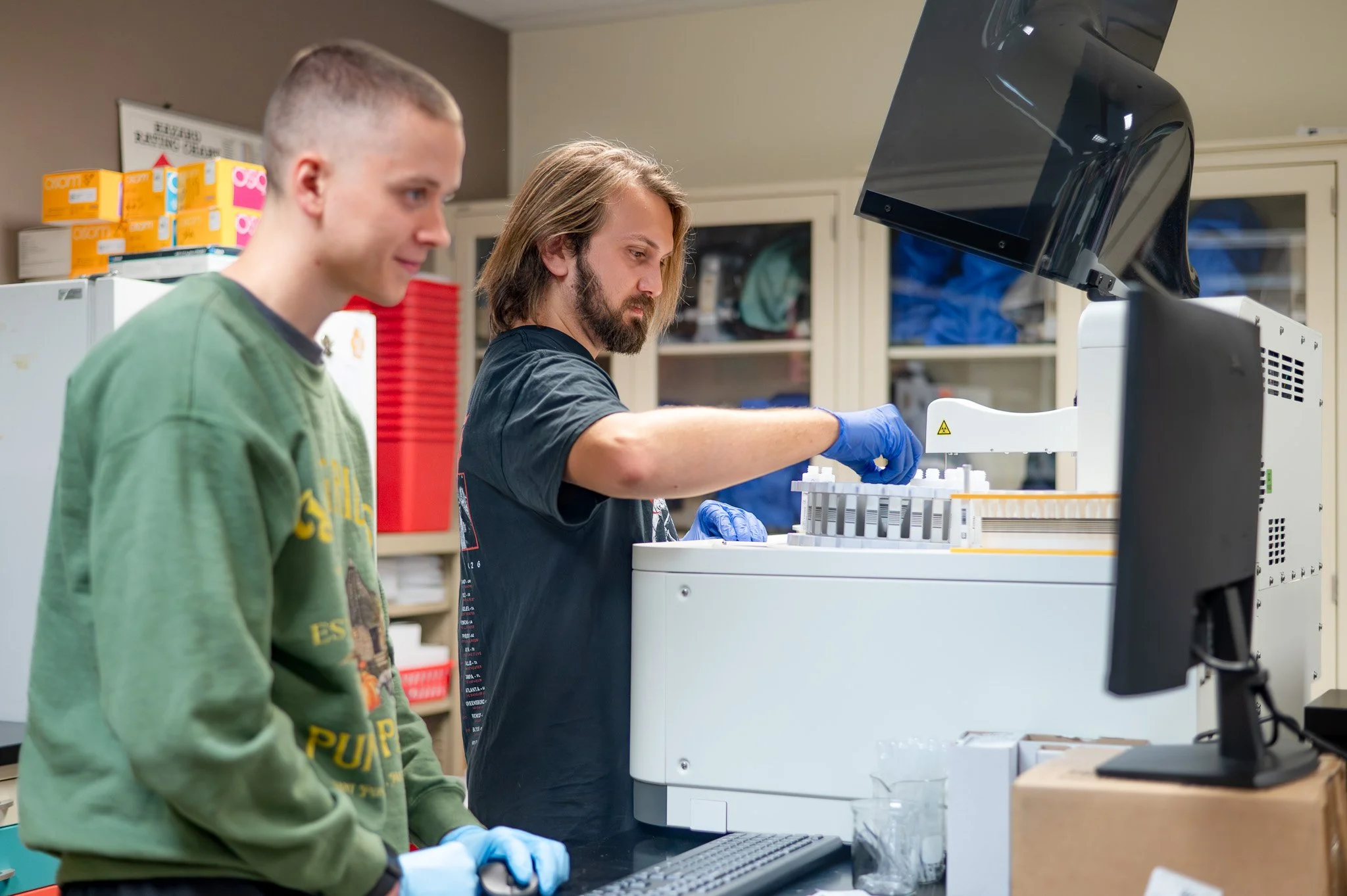 MLT students Justin Oppy (left) and Gabriel Short (right) using the Diatron Pictus 500 in the lab