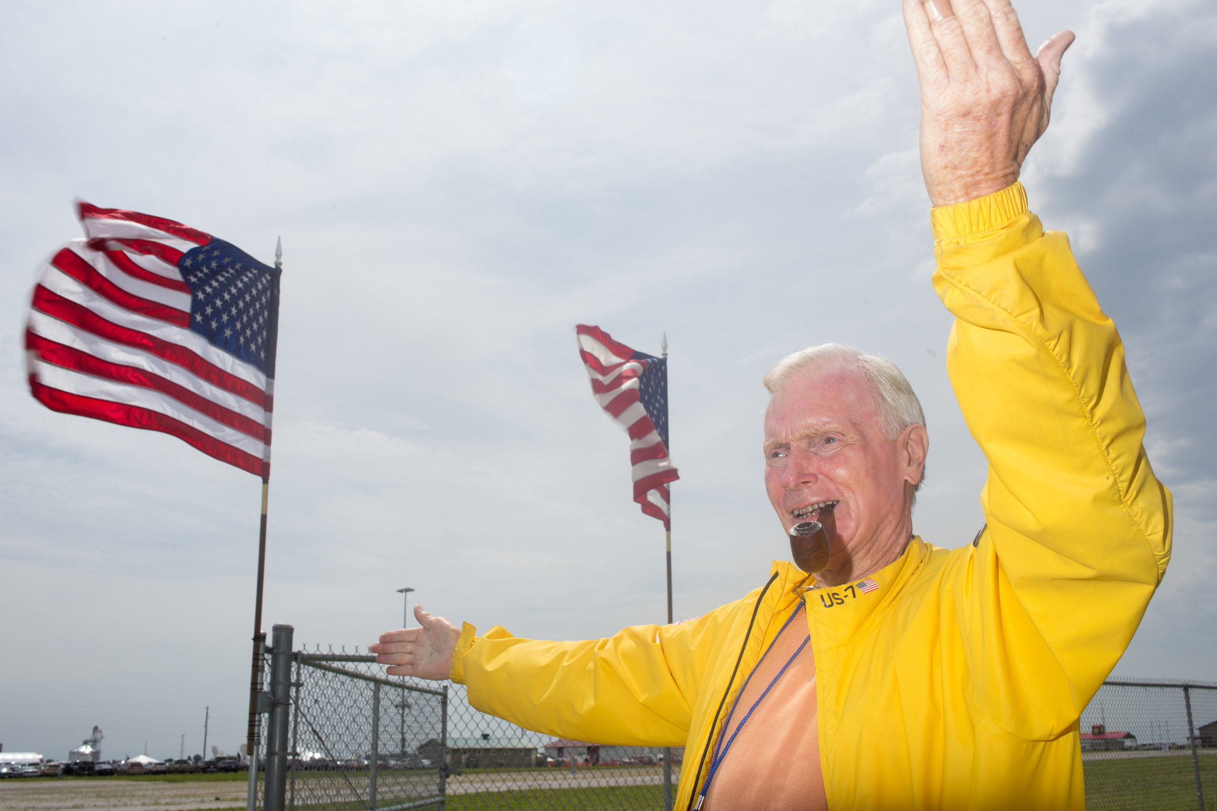  A man directs traffic at Senator Joni Ernst's First Annual Roast &amp; Ride on June 6, 2015 in Boone, Iowa.  