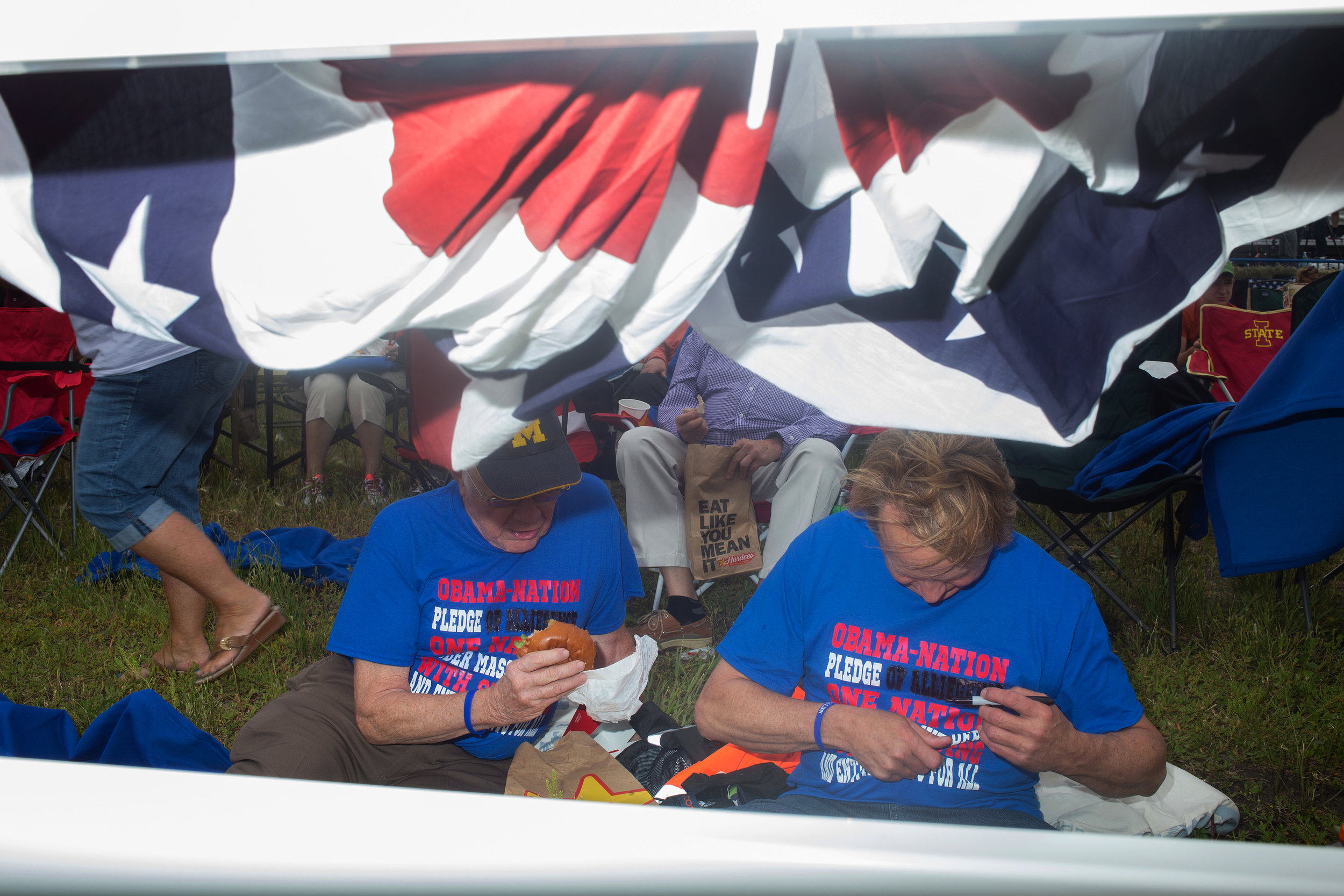  Attendees fix a spelling error on their shirts at Senator Joni Ernst's First Annual Roast &amp; Ride on June 6, 2015 in Boone, Iowa.  