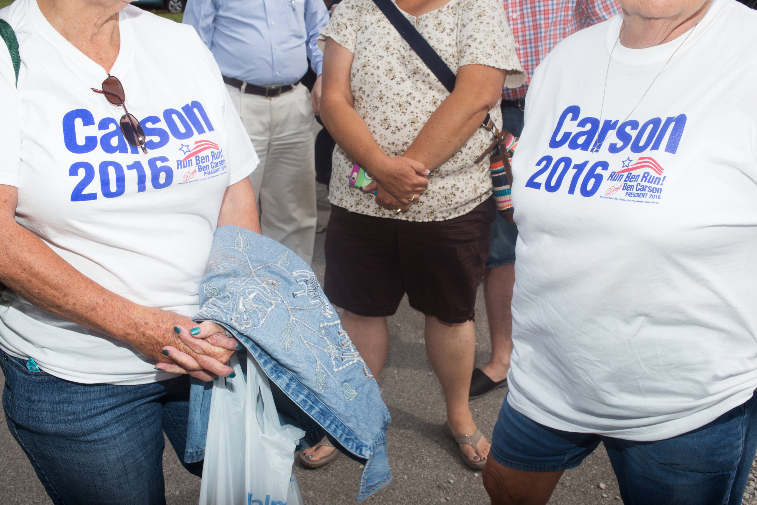  Ben Carson supporters wait in line at Senator Joni Ernst's First Annual Roast &amp; Ride on June 6, 2015 in Boone, Iowa.  