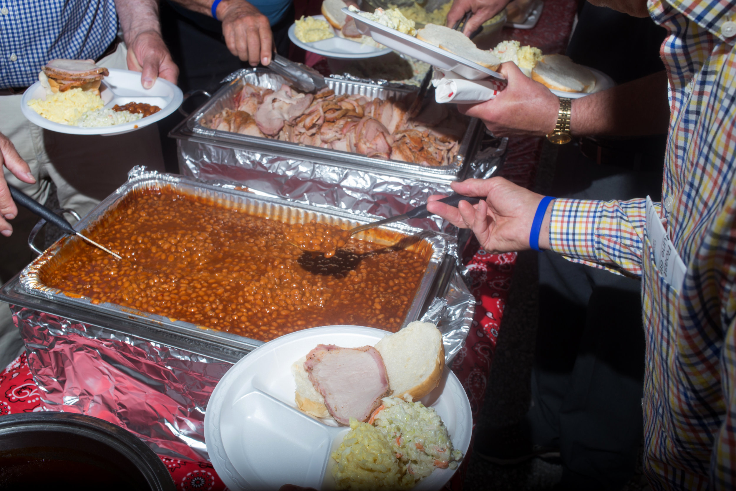  Attendees pile food on their plates at Senator Joni Ernst's First Annual Roast &amp; Ride on June 6, 2015 in Boone, Iowa.  