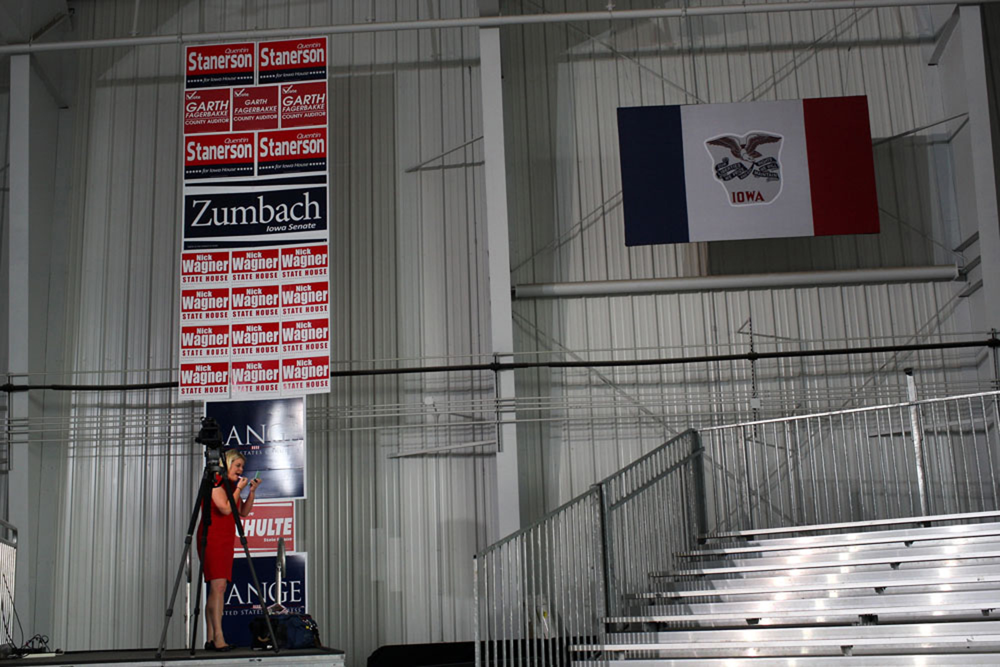  A member of the media applies makeup before then-presidential nominee Mitt Romney speaks at Landmark Aviation on October 24, 2012 in Cedar Rapids, Iowa.  