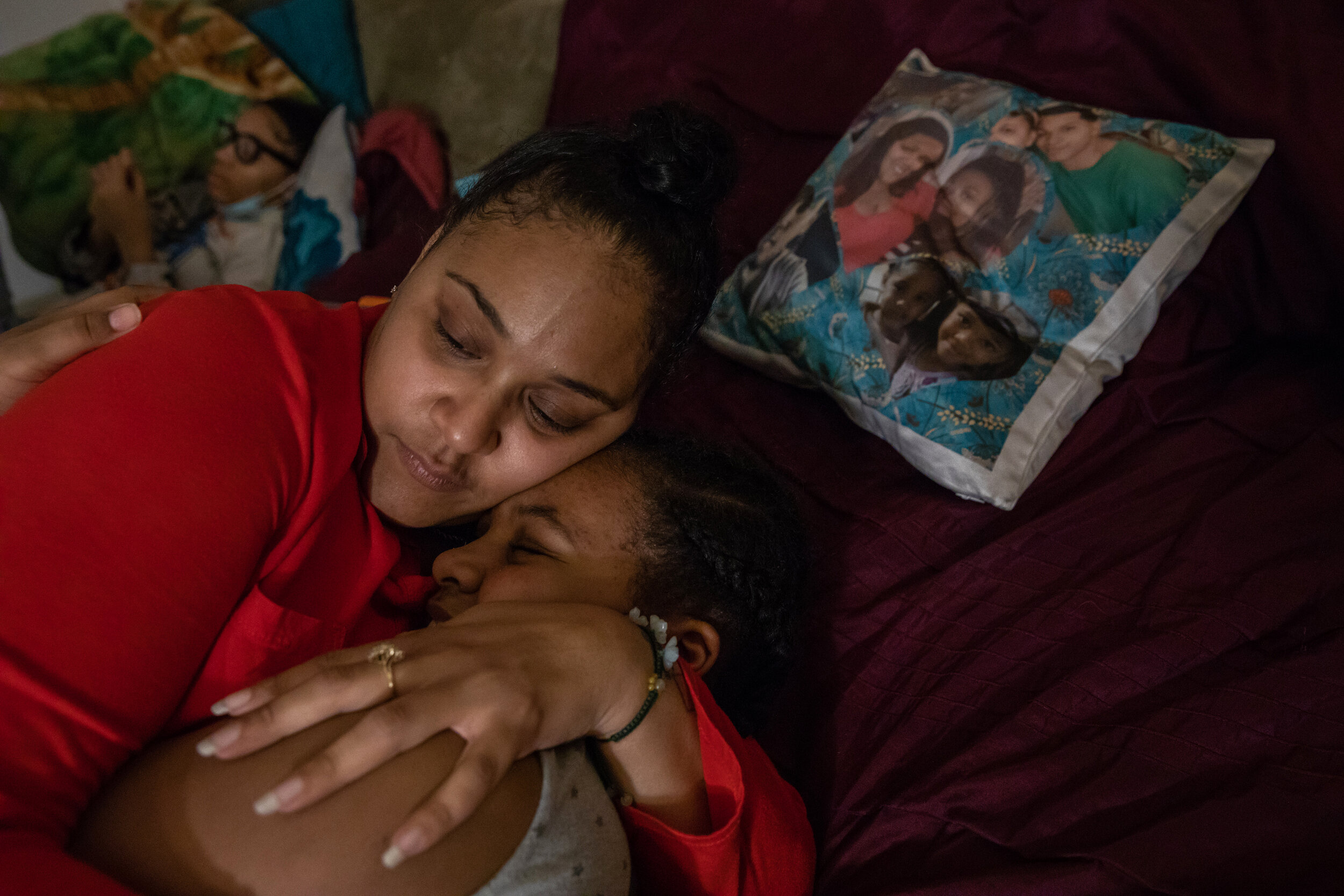  Nawaal Walker embraces her daughter, Ca'leah, in their home in Durham, North Carolina, on Dec. 6, 2020. The global COVID-19 pandemic has exacerbated and magnified the eviction crisis, especially for women of color. (For  HuffPost ) 