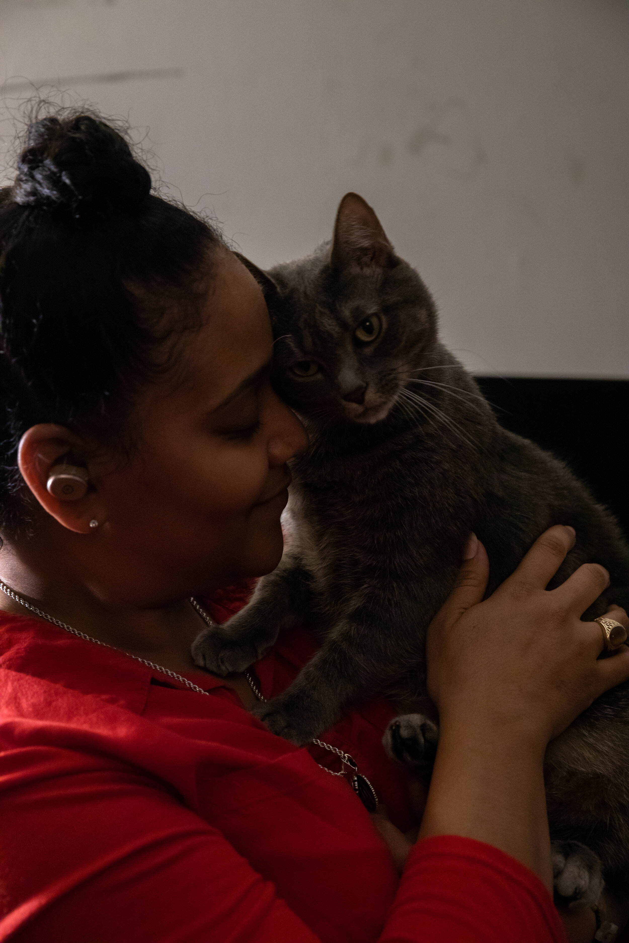  Nawaal Walker holds her cat, Oscar, in her home in Durham, North Carolina, on Dec. 6, 2020. The global COVID-19 pandemic has exacerbated and magnified the eviction crisis, especially for women of color. (For  HuffPost )  