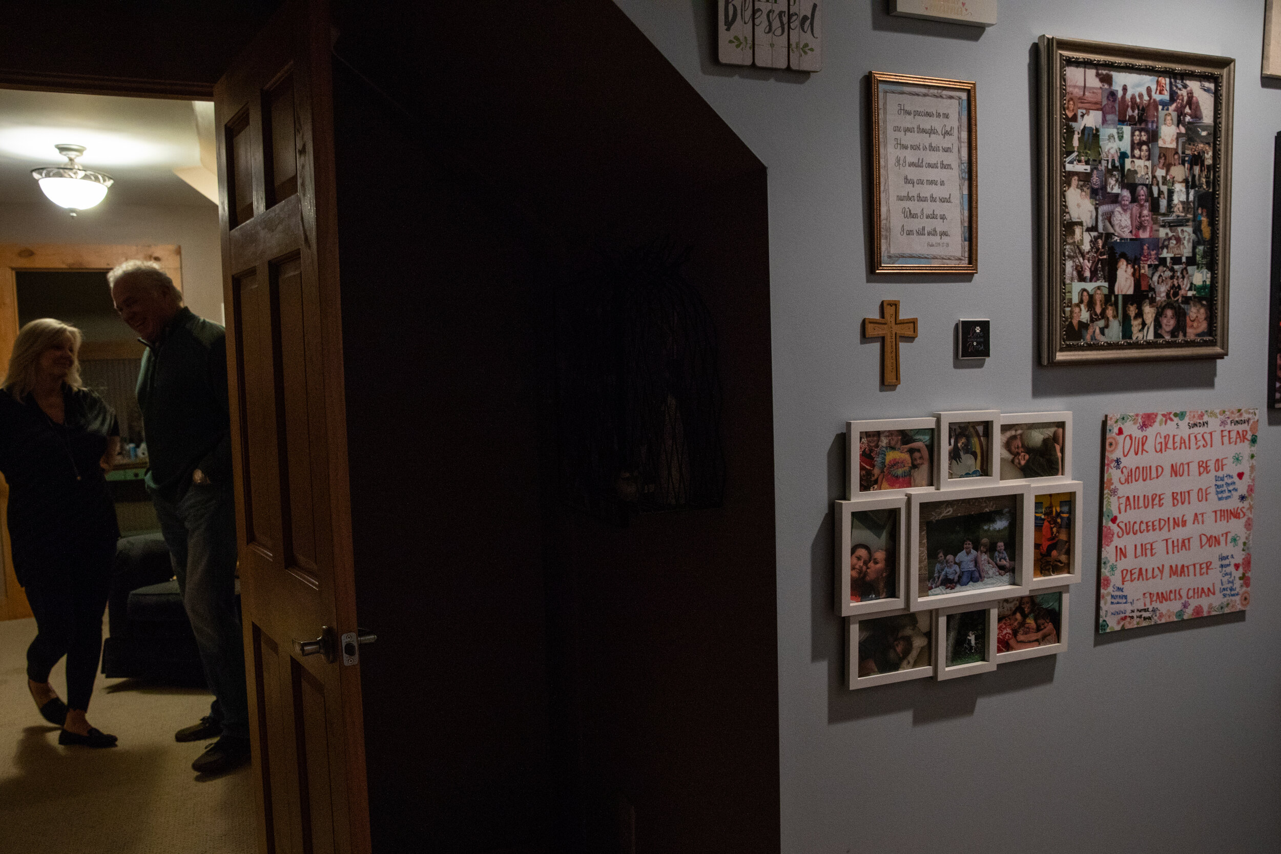  Photographs and memorabilia line the walls and a stand in the home of Cindy and Mark Bezzek in Sanford, North Carolina, on Dec. 19, 2020. Both lost their mothers to COVID-19; their daughter died of an overdose after not being able to receive care be