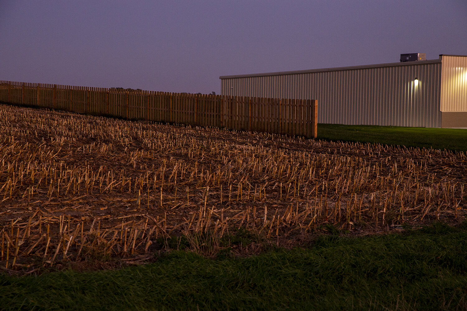  A field next to Dollar General, on the southern edge of Larchwood. In smaller, rural communities, the arrival of dollar store chains can be both welcomed and threatening; in some cases, they are seen as filling a void, while in others, they run loca