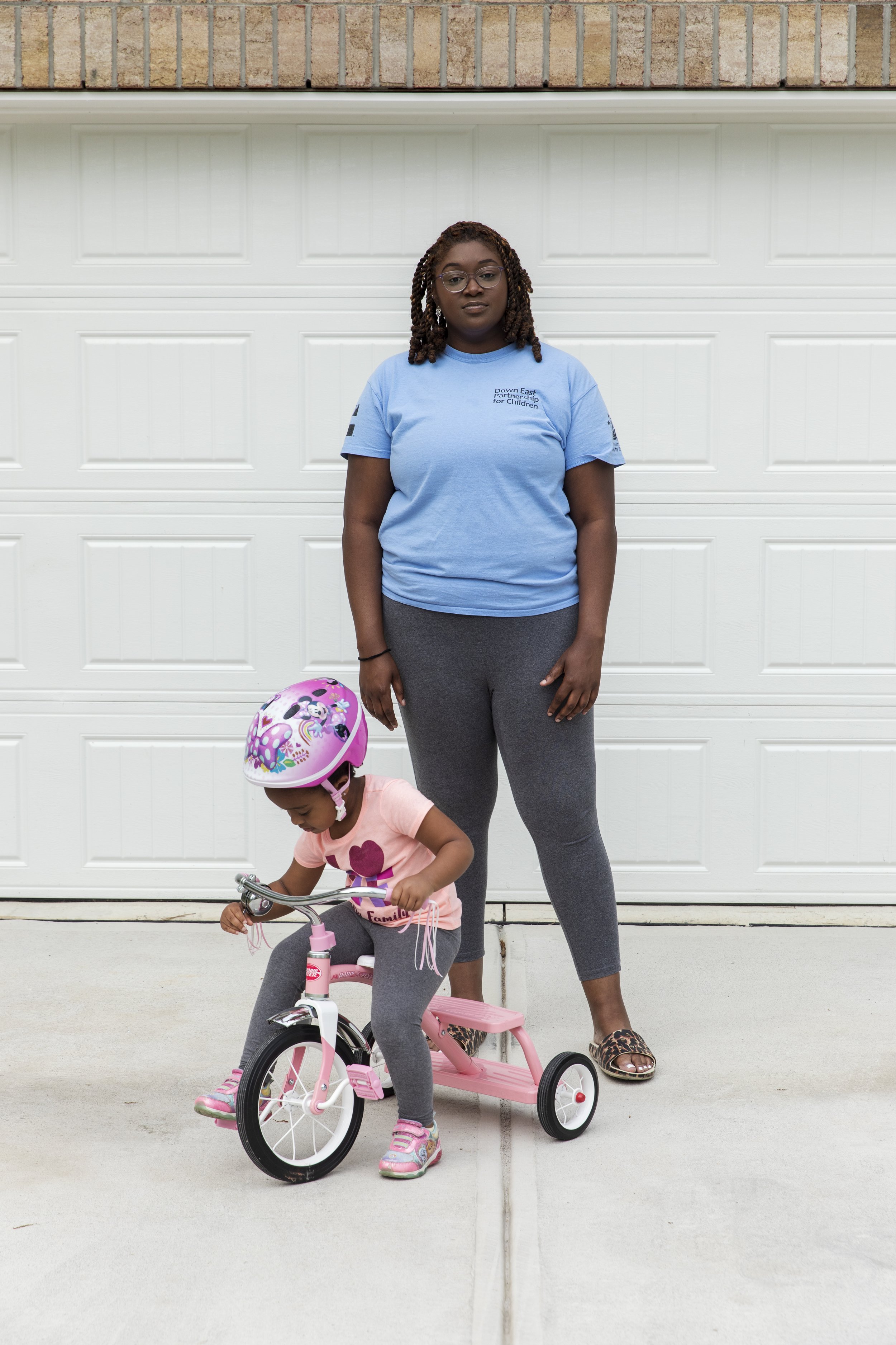  Kyler Daniels, 27, stands outside her home with four-year-old daughter, Nova, in Rocky Mount, NC on Wednesday, April 26, 2023. Daniels lives with her daughter, boyfriend, mother, and sister in order to save up for her own place. (Rachel Jessen/The G