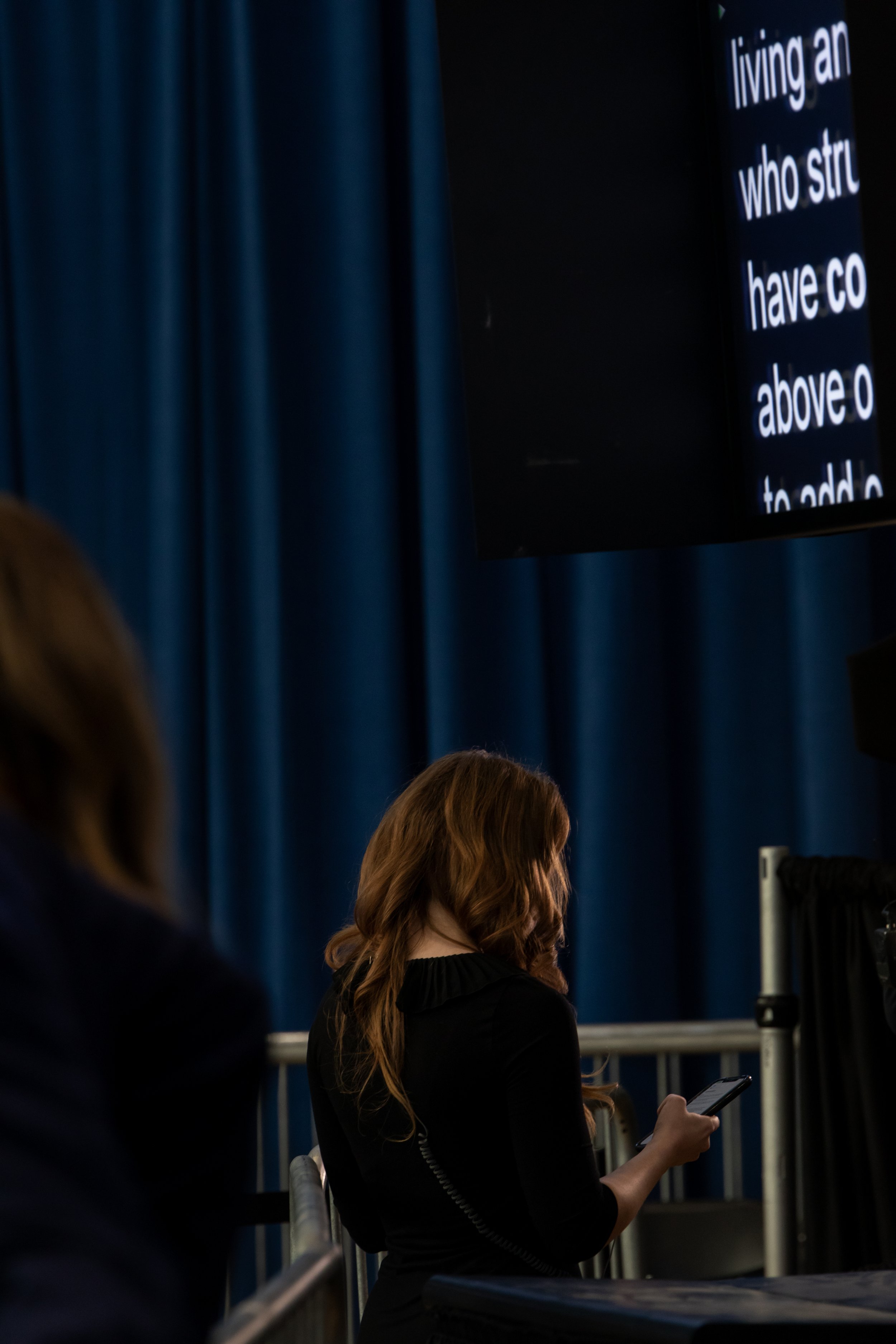  A reporter glances at her phone ahead of US President Joe Biden speaking at an economic event at Abbotts Creek Community Center in Raleigh, North Carolina, US, on Thursday, Jan. 18, 2024. (Rachel Jessen/Bloomberg) 