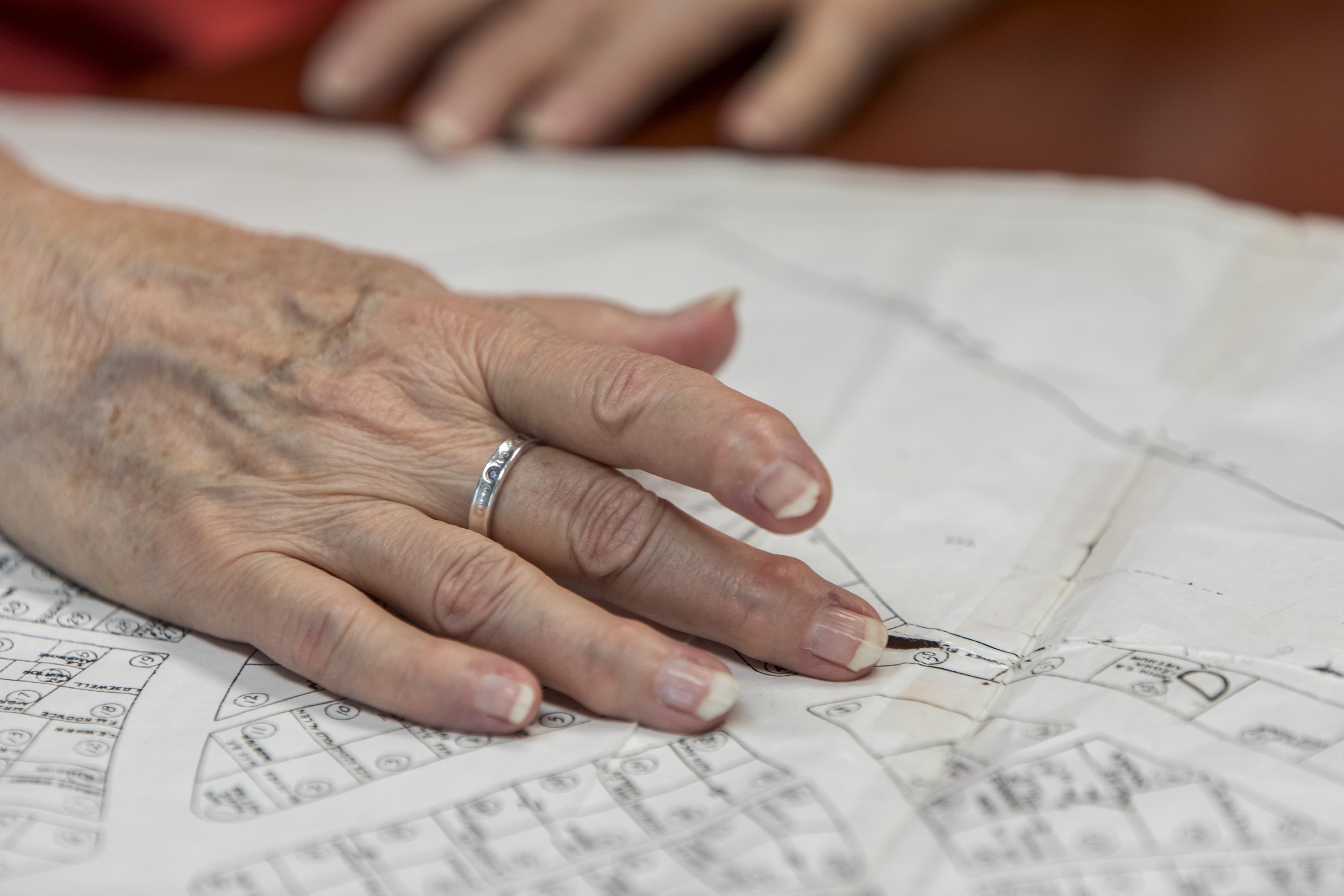  Jeri Kozobarich touches a map of the cemetery in which her baby is buried in Jacksonville, NC on Tuesday, July 18, 2023. (Rachel Jessen for NBC News) 