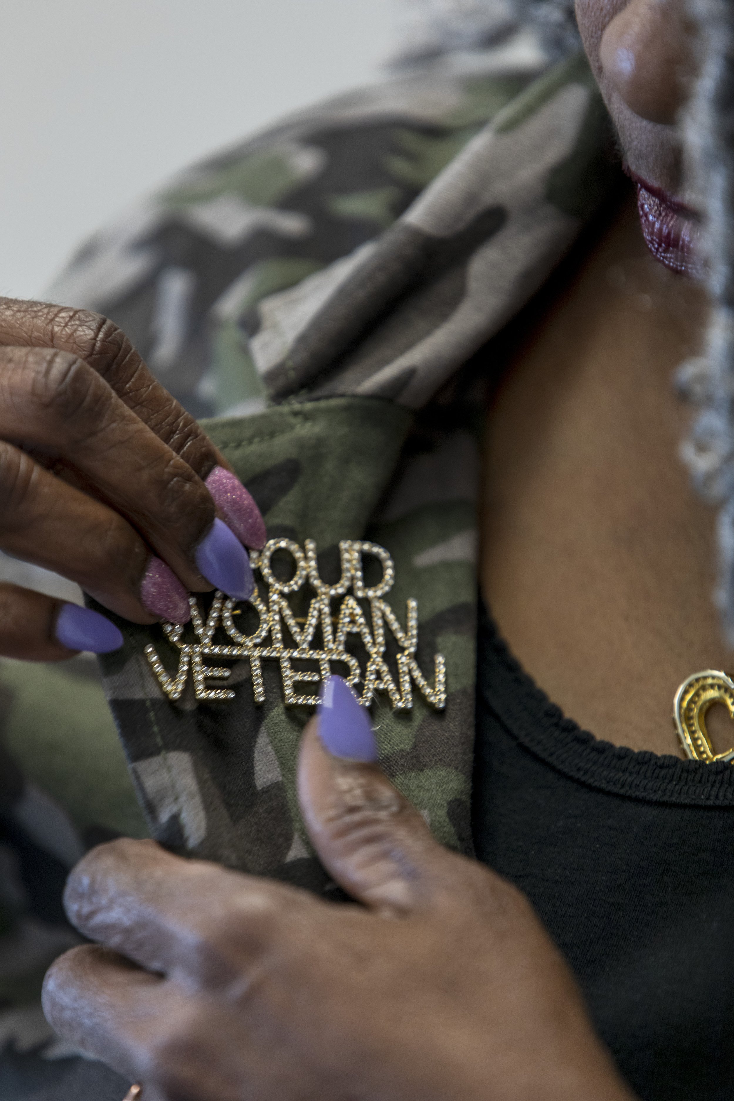  LaVeda Bennett adjusts a pin on her jacket in Jacksonville, NC on Tuesday, July 18, 2023. (Rachel Jessen for NBC News) 