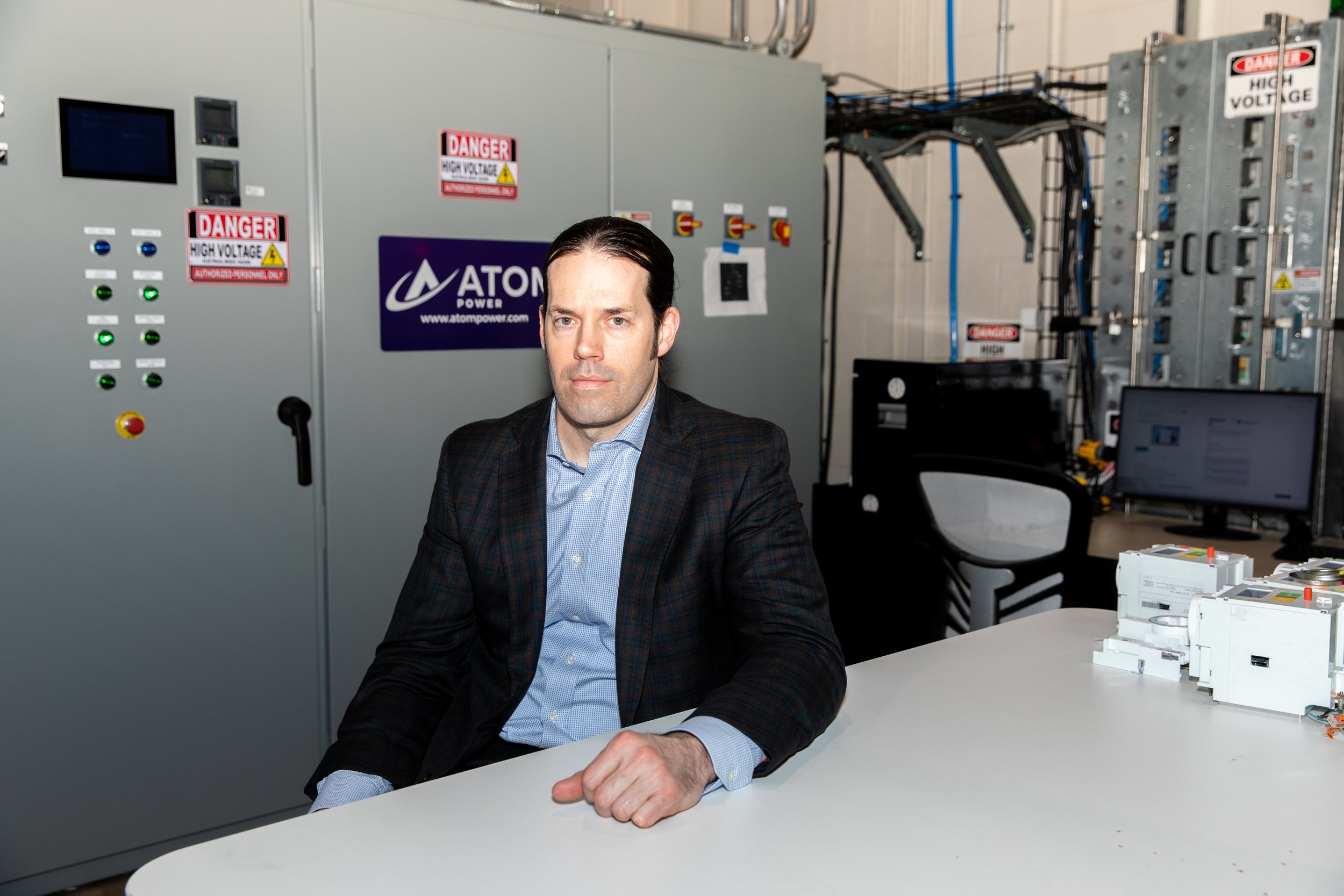  Atom Power CEO Ryan Kenned poses at the company’s headquarters in Huntersville, NC on Friday, January 27, 2023. Atom Power designs and creates EV charging solutions, which utilize a solid-state digital circuit breaker that charges from a centralized
