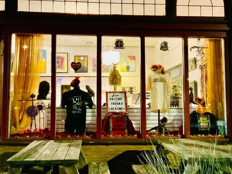 The front window  the the Albina Ars Salon now the Soul Restoration Center.