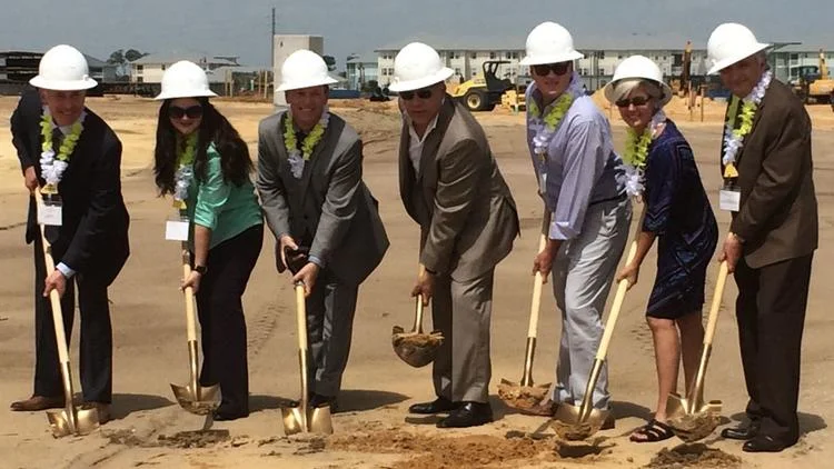 On hand Wednesday morning for a ceremonial groundbreaking at the Margaritaville Resort's hotel site in Osceola County were, from left to right: Don Fisher (county manager), Peggy Choudhry (county commissioner), Jim Bagley (Margaritaville development manager), Art Falcone (Encore CEO), Brandon Arrington (commission chairman), Cheryl Greib (county commissioner) and Abraham Pizam (UCF Rosen College).