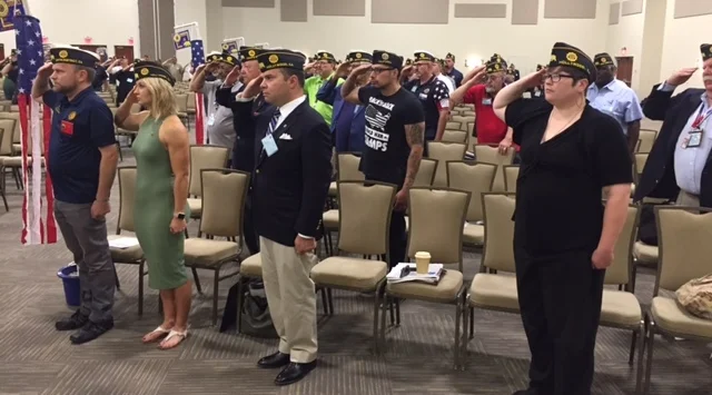 Post 43 delegates saluting the colors