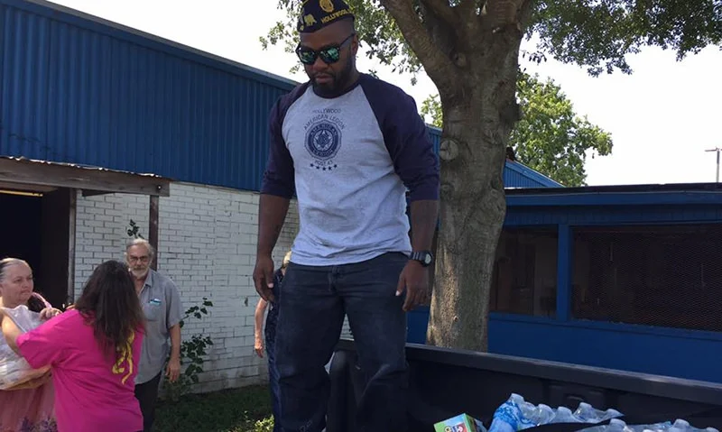 Hollywood Post 43 member Andre Andrews helps distribute water in Texas. Photo by Charles Chavez