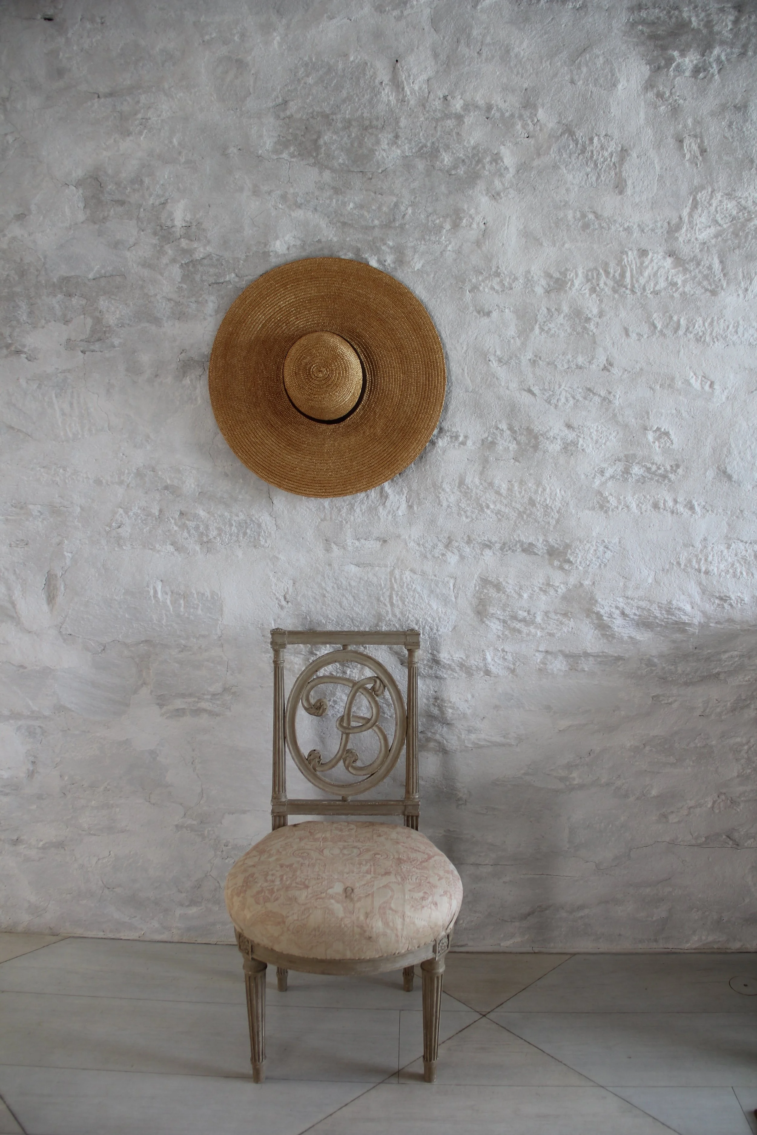 A chair and hat in the Oak Spring Garden Library.