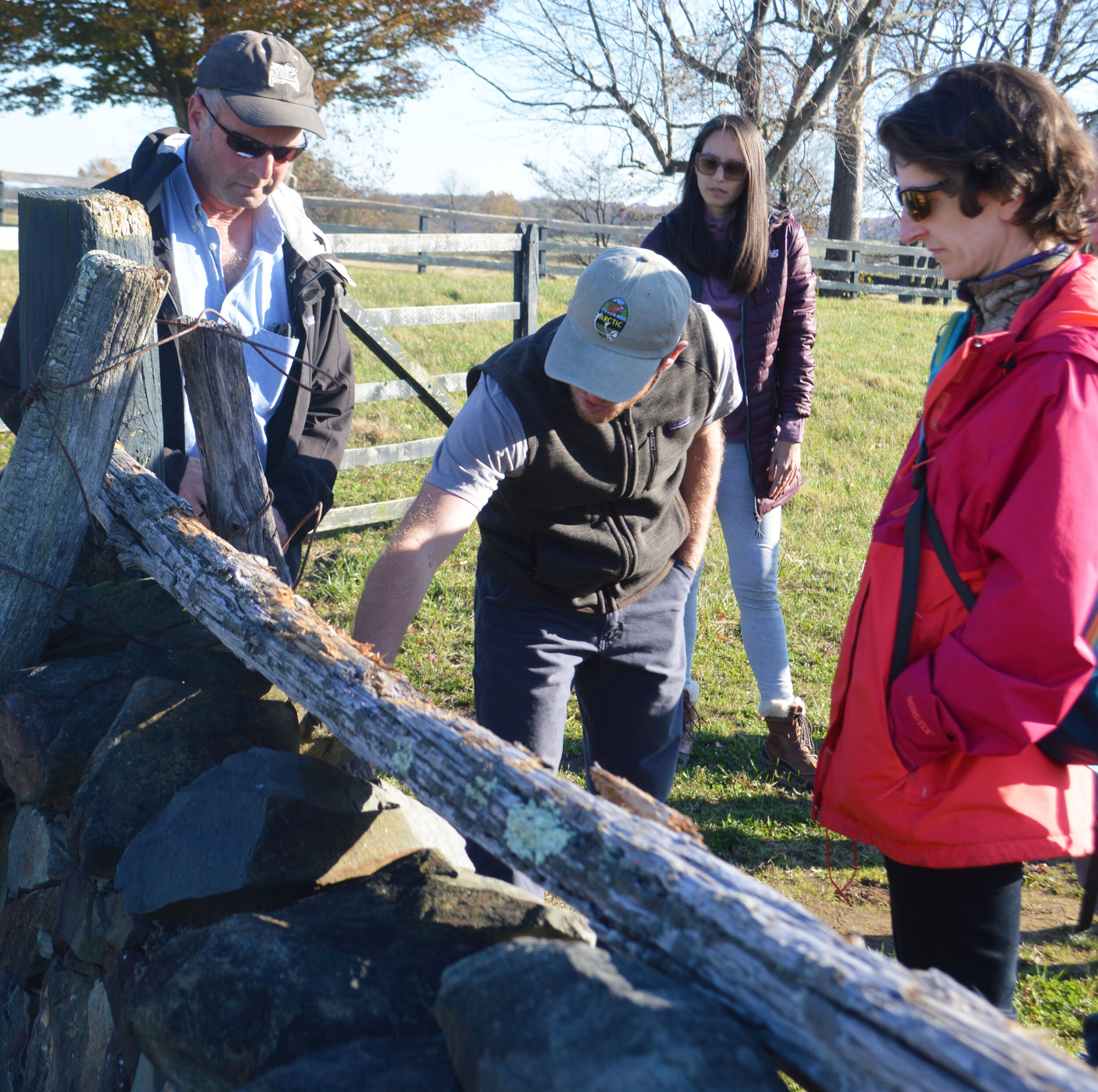  Michael Gaige shows course participants how to interpret one of the many stone walls on the Rokeby property. Such walls can tell ecologists and historians a lot about the land: at Oak Spring, for instance, there are two miles of stone fencing, made 