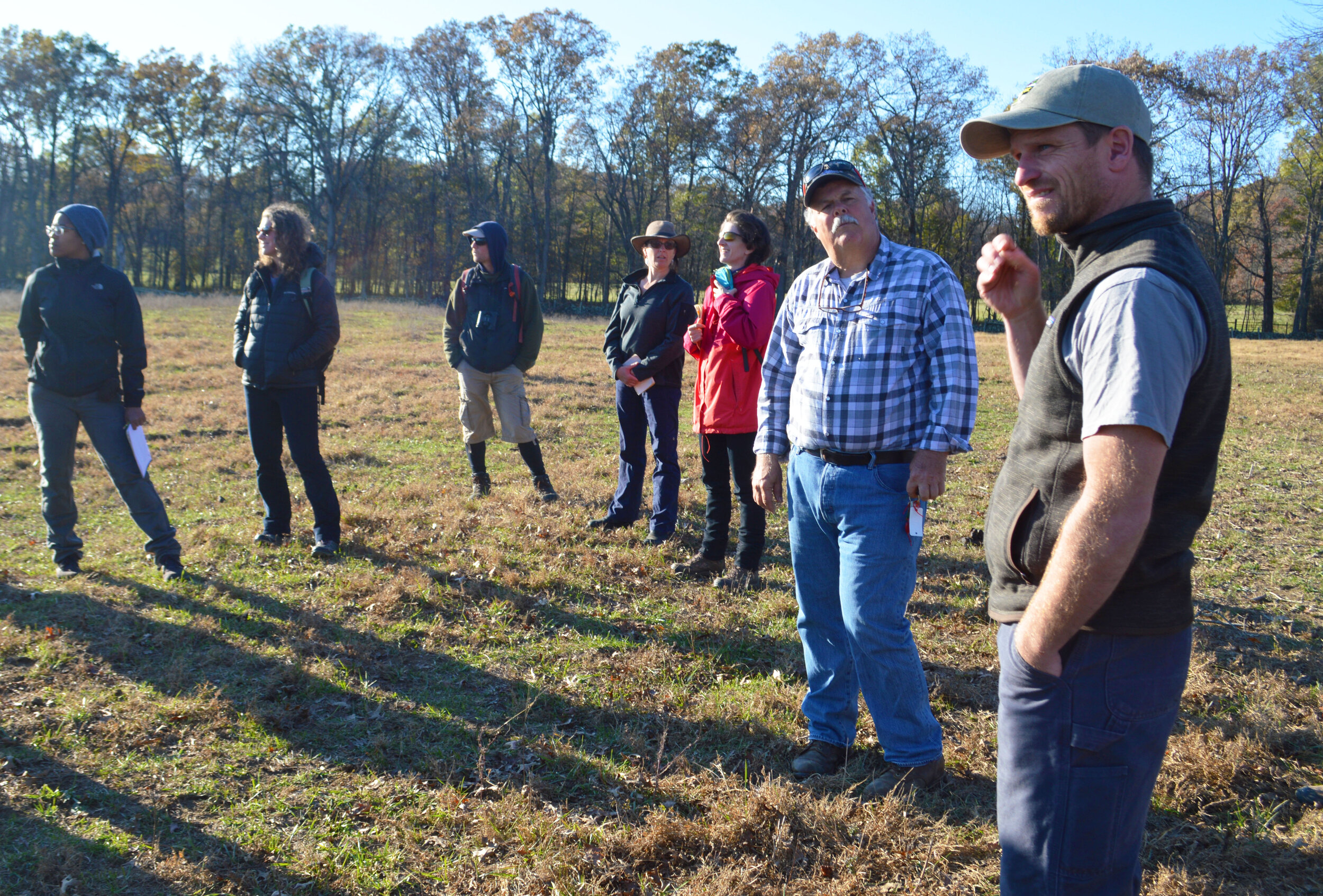  Ecologist Michael Gaige, far right, and local pasture expert Mike Sands, at his left, discuss the grass and soil composition in one of Rokeby’s horse pastures. Mike Sands, who runs Bean Hollow Grassfed farm in Flint Hill, is one of the expert guest 