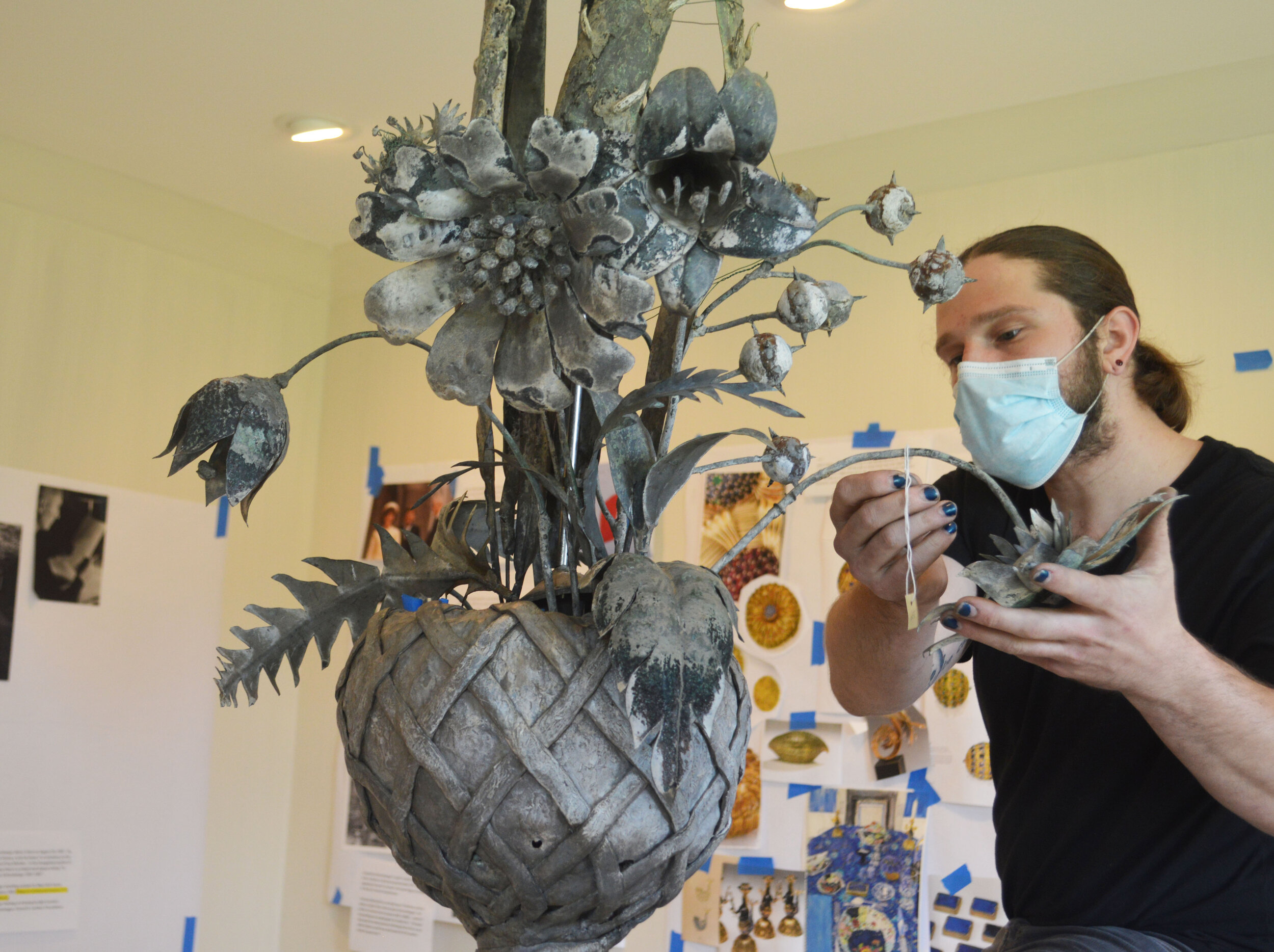  Arranging the conserved original finial in the Oak Spring Garden Gallery in July 2020. 