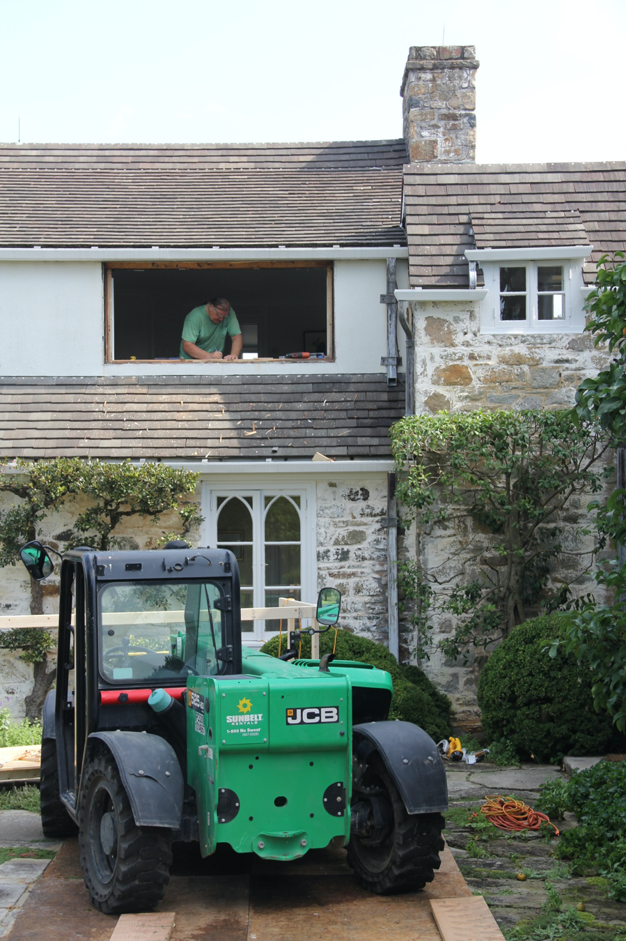  Restoration work continues to extend the life of many of the cherished locations and features on the property. Here, OSGF staff install new custom-made windows in the Mellon Main Residence to replace the originals in which the frames had rotted. 