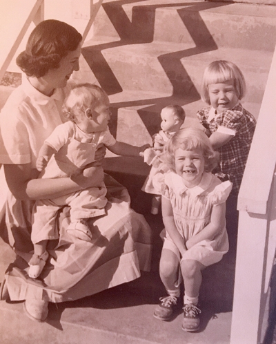 In the 1950s no one was talking about gender variance. I'm the toddler sitting on my mother's lap, reaching for my sister's doll.