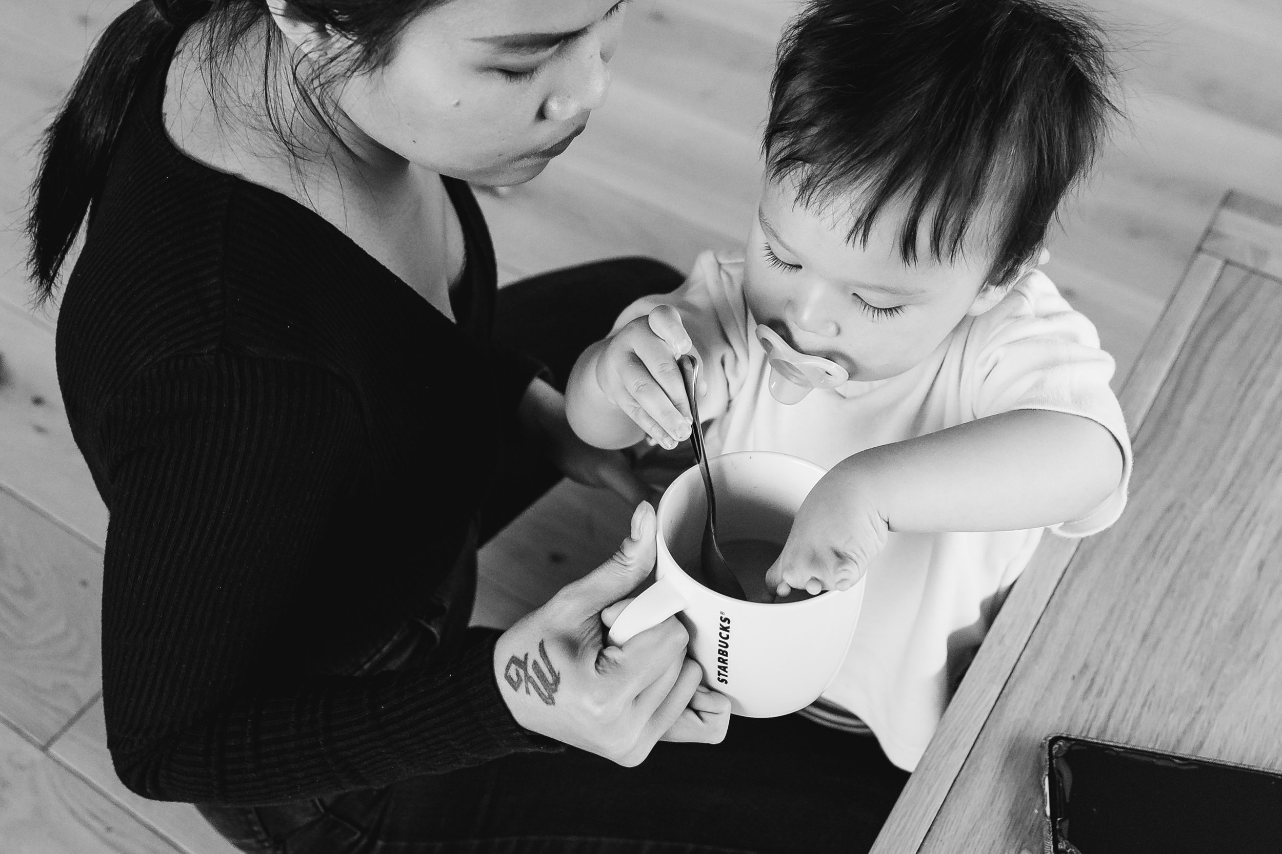 Baby playing with tea cup