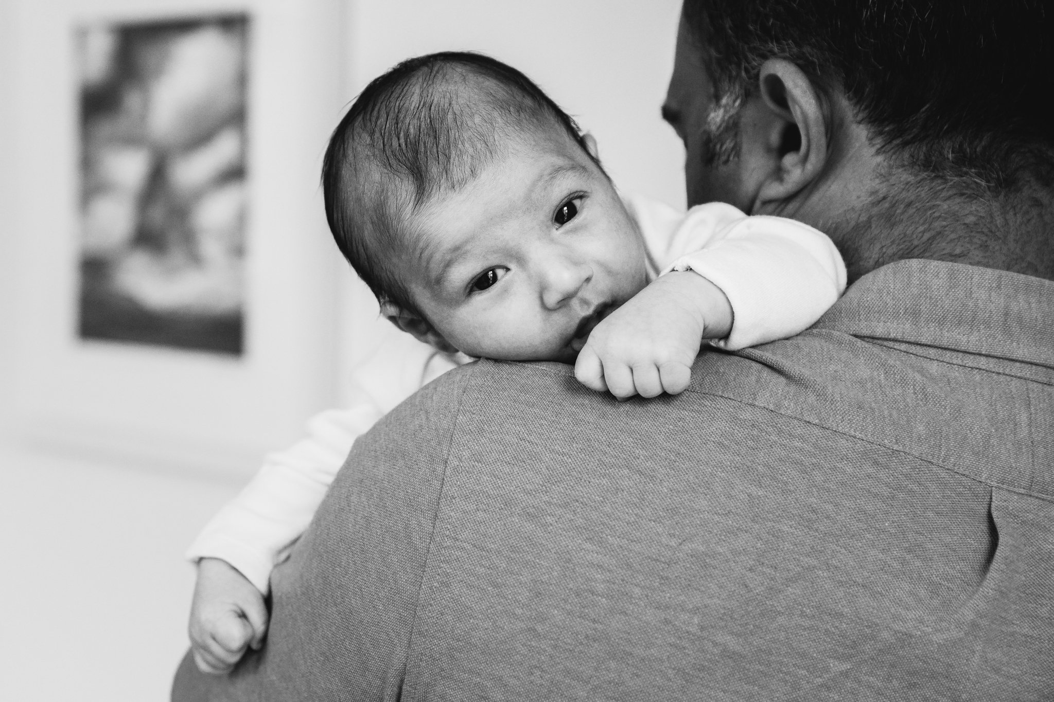  Newborn baby held over shoulder 